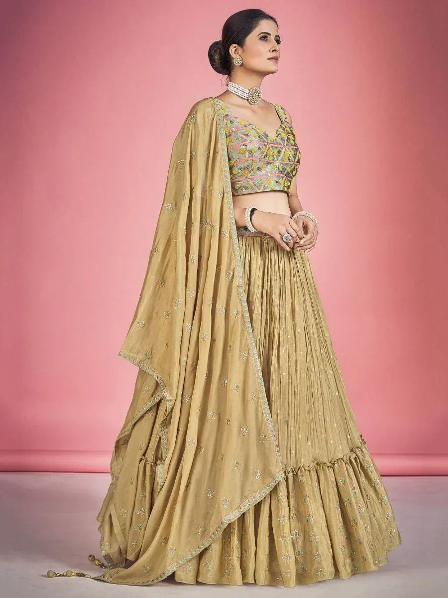 Elegant gold lehenga choli with floral embroidery, perfect for Indian ethnic wear and festive occasions.