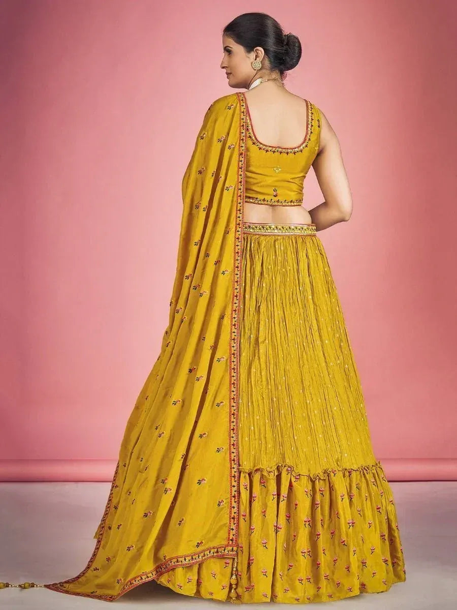 Yellow embroidered lehenga choli with floral dupatta, perfect for Indian ethnic wear occasions