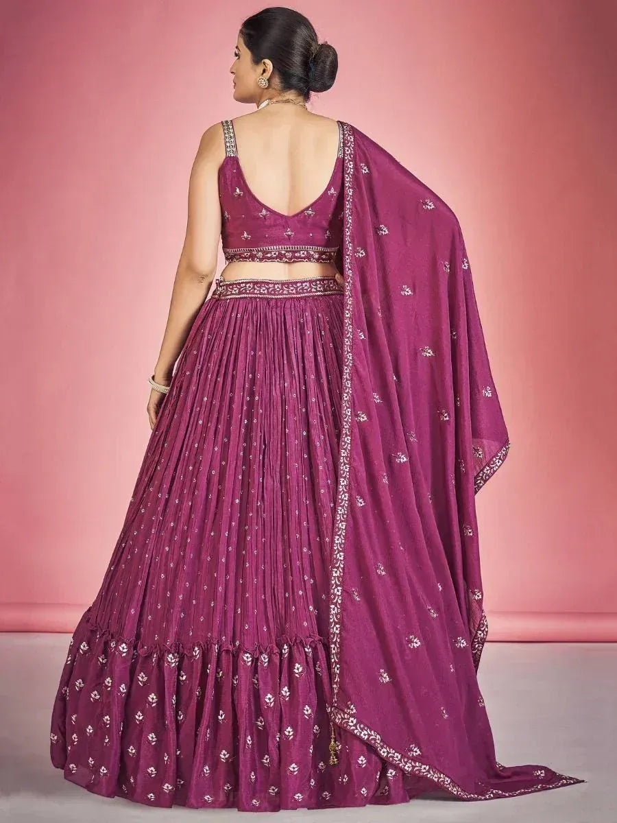 Purple designer lehenga choli with floral embroidery and pleated skirt, perfect for Indian ethnic occasions
