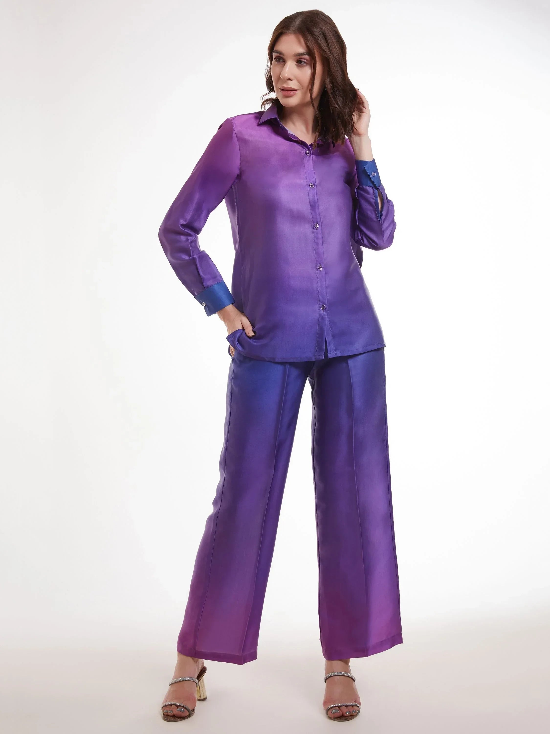 Woman wearing a purple ombre satin shirt and matching wide-leg pants set