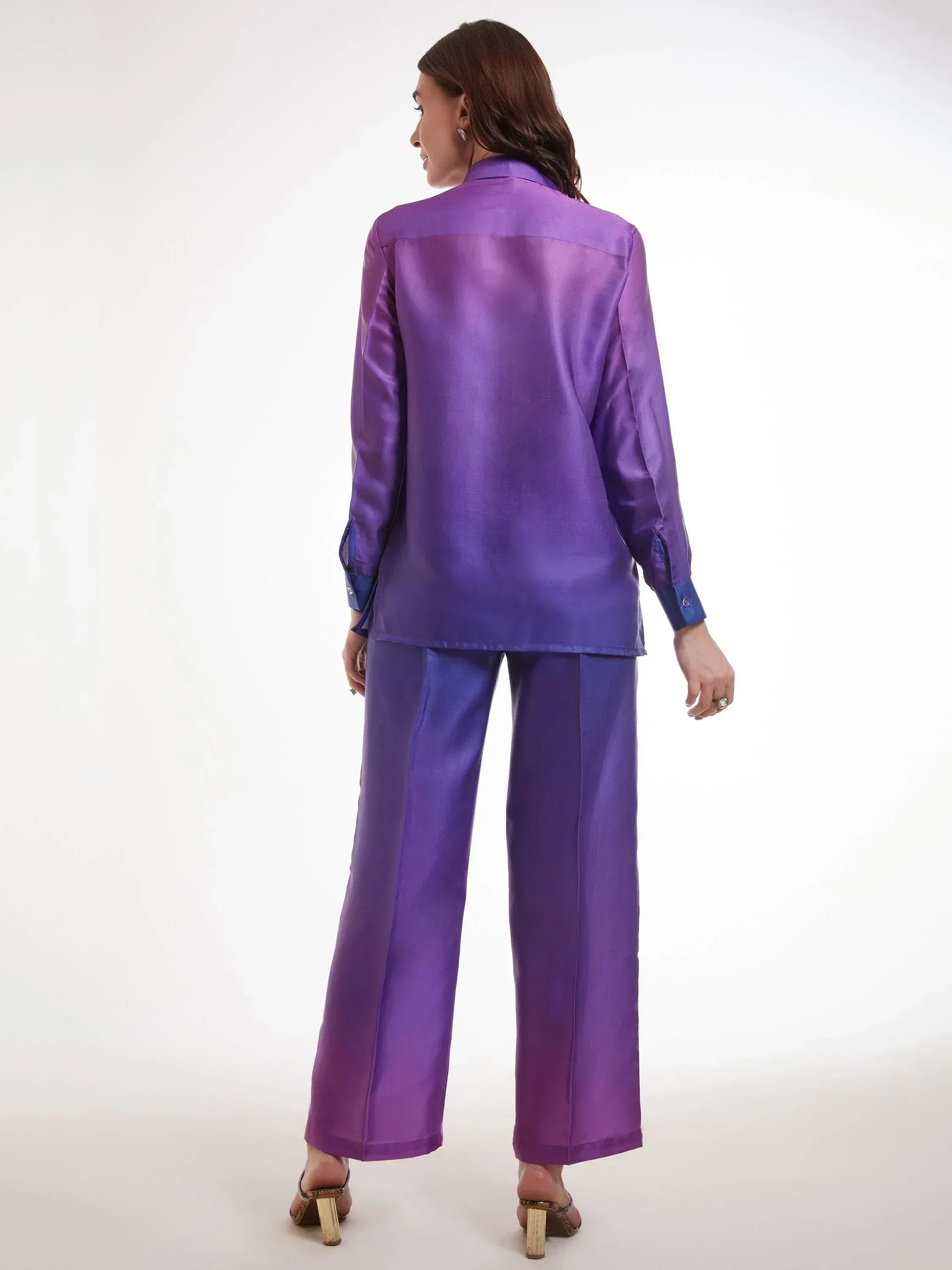 Purple satin ethnic pantsuit with wide-leg trousers and contrast cuffs, perfect for modern Indian occasions.