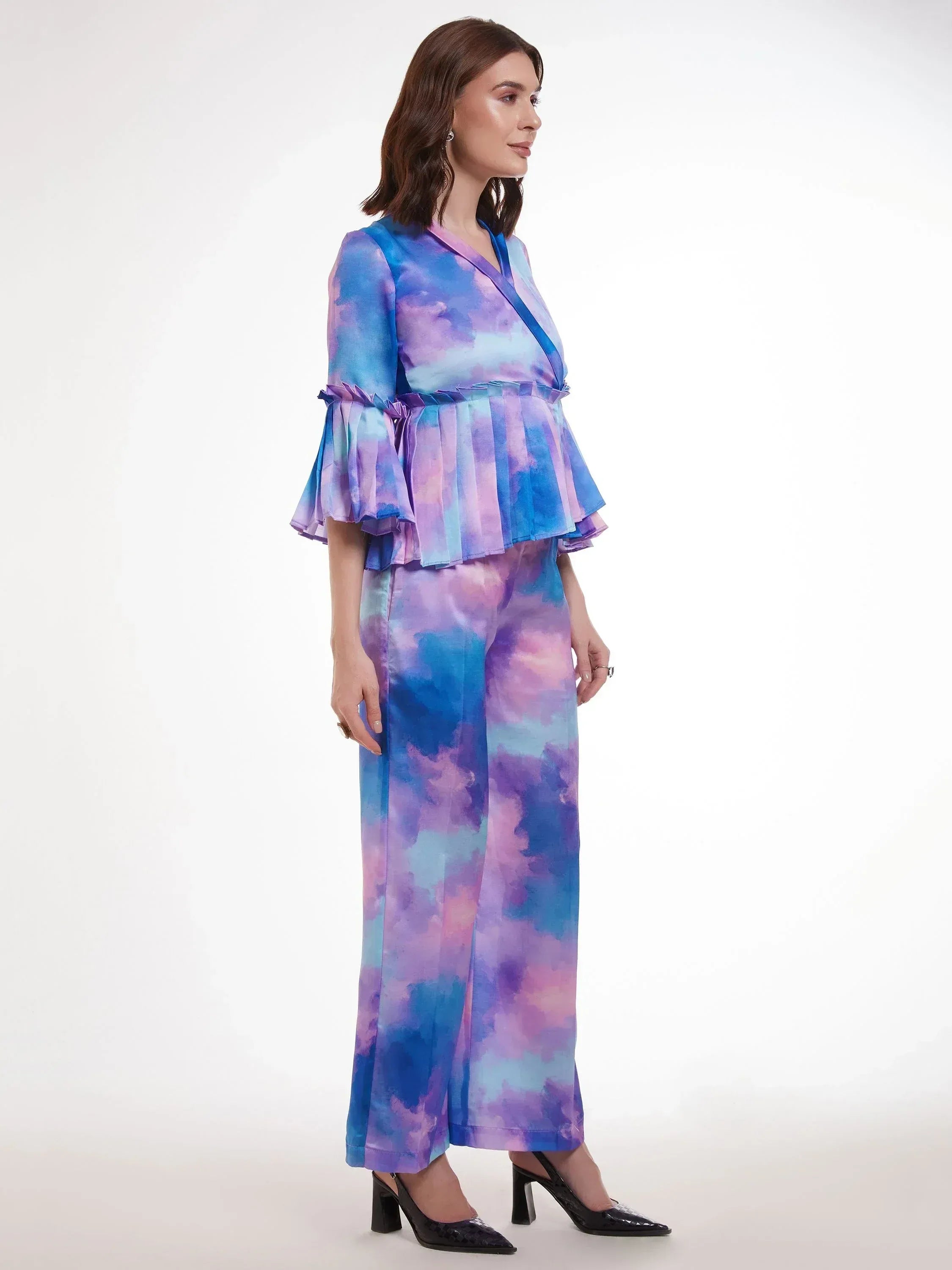 Woman in blue purple tie-dye ethnic palazzo set with ruffled top, stylish Indian wear