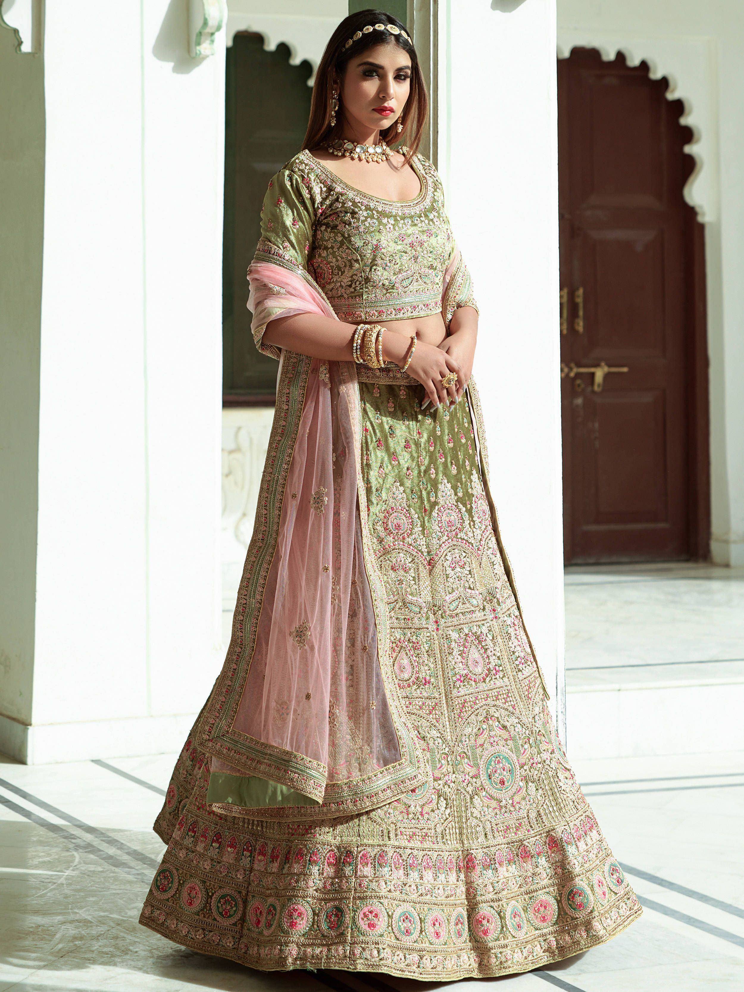 Elegant olive green lehenga choli with pink dupatta, intricate embroidery, perfect for Indian weddings and festive occasions.