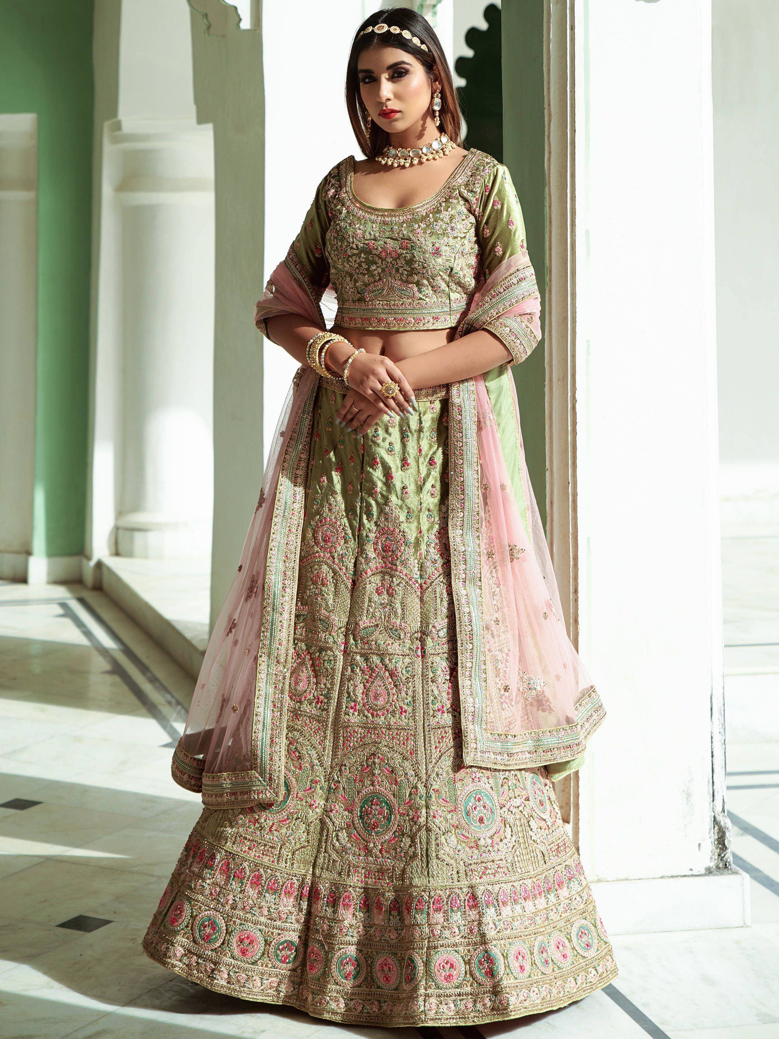 Elegant green and pink embroidered lehenga choli with dupatta, perfect for Indian weddings and festive occasions.
