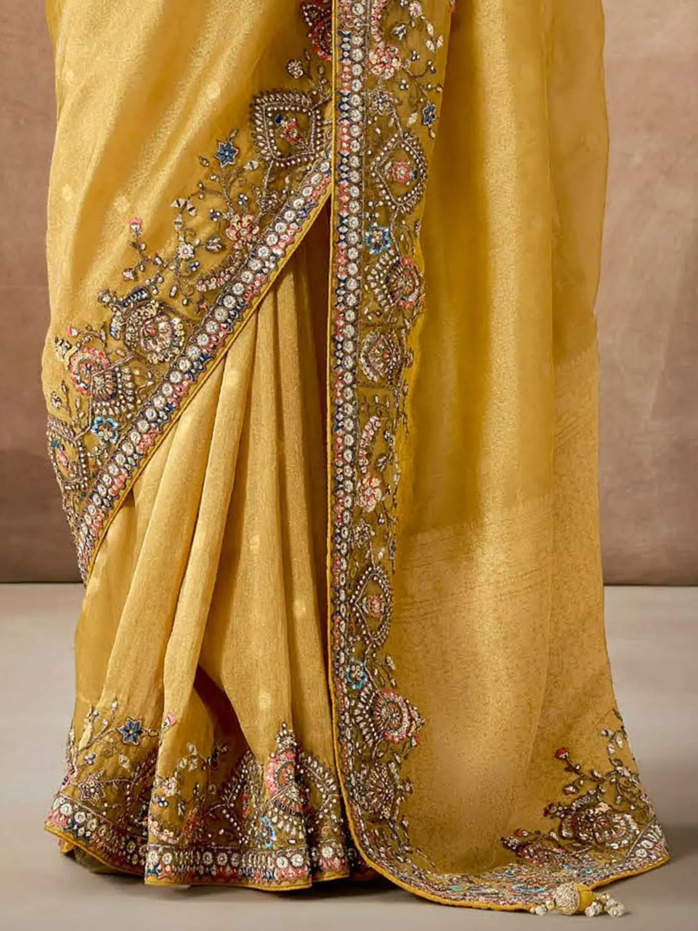 Golden saree with intricate floral embroidery and beadwork, perfect for Indian ethnic wear occasions
