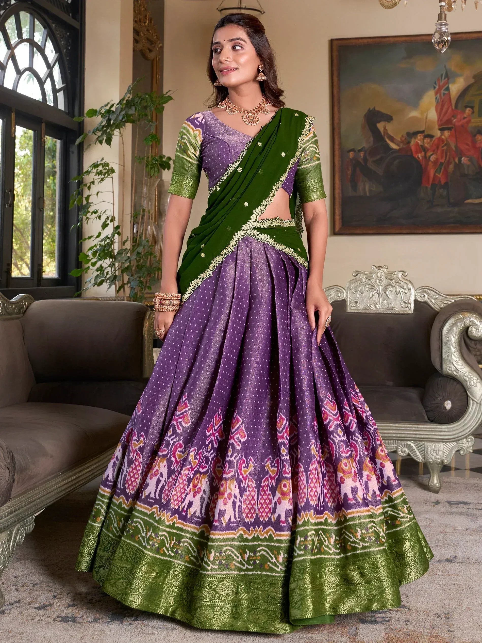 Purple and green designer lehenga choli with elephant print and gold embroidery, perfect for Indian ethnic wear