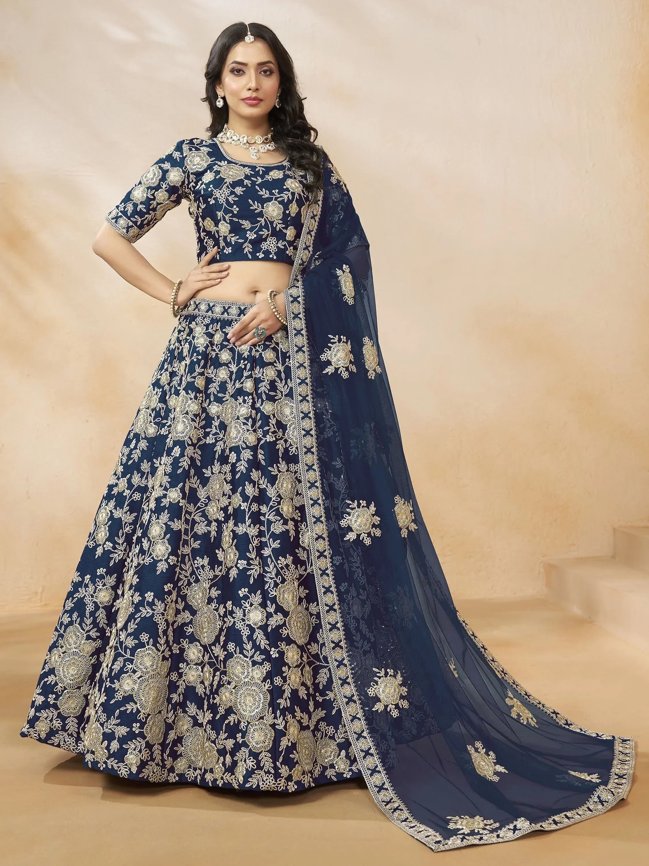 Navy blue designer lehenga choli with gold floral embroidery and sheer dupatta for Indian ethnic wear