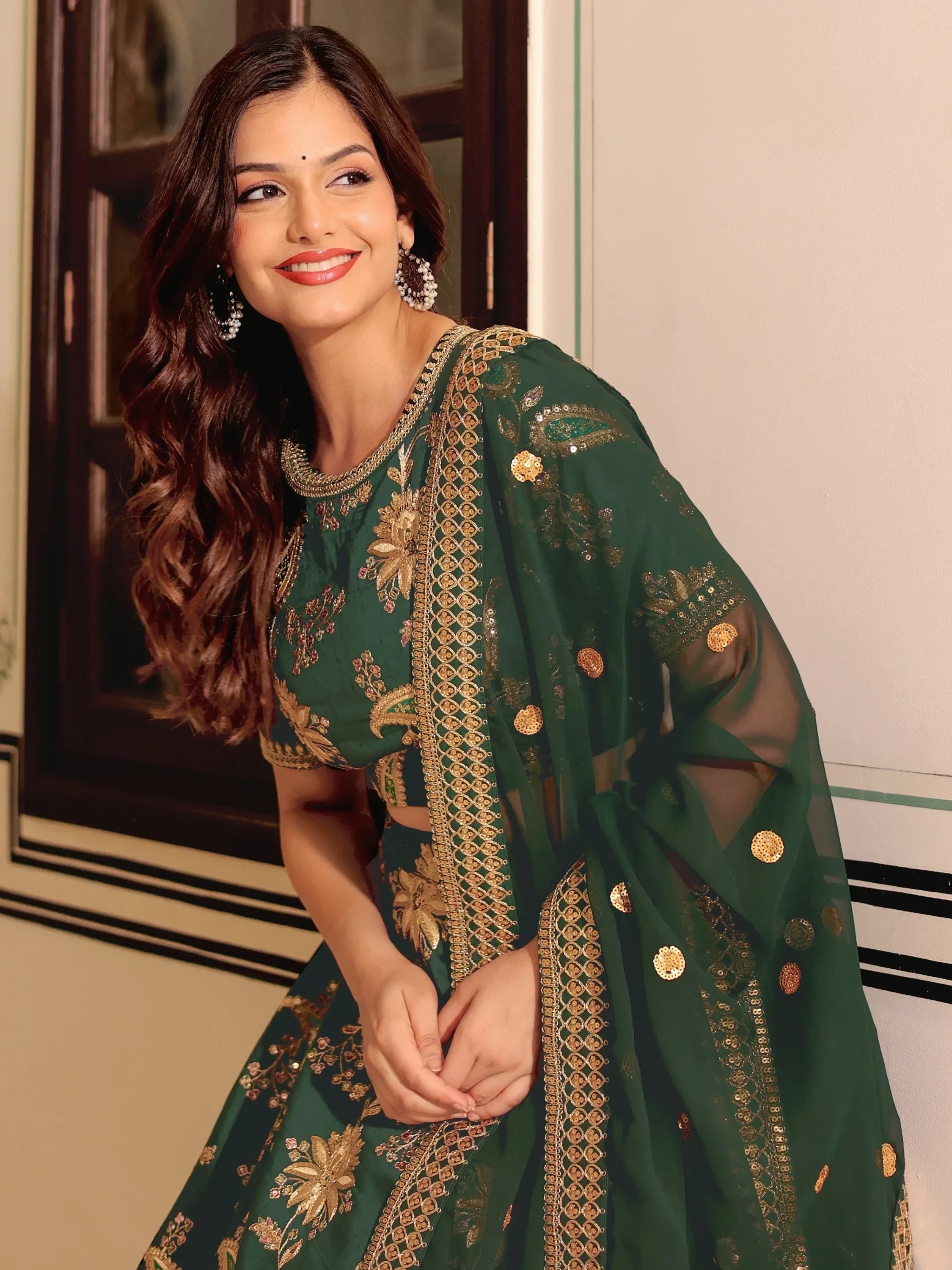 Green embroidered lehenga choli with gold detailing, perfect for Indian ethnic wear occasions
