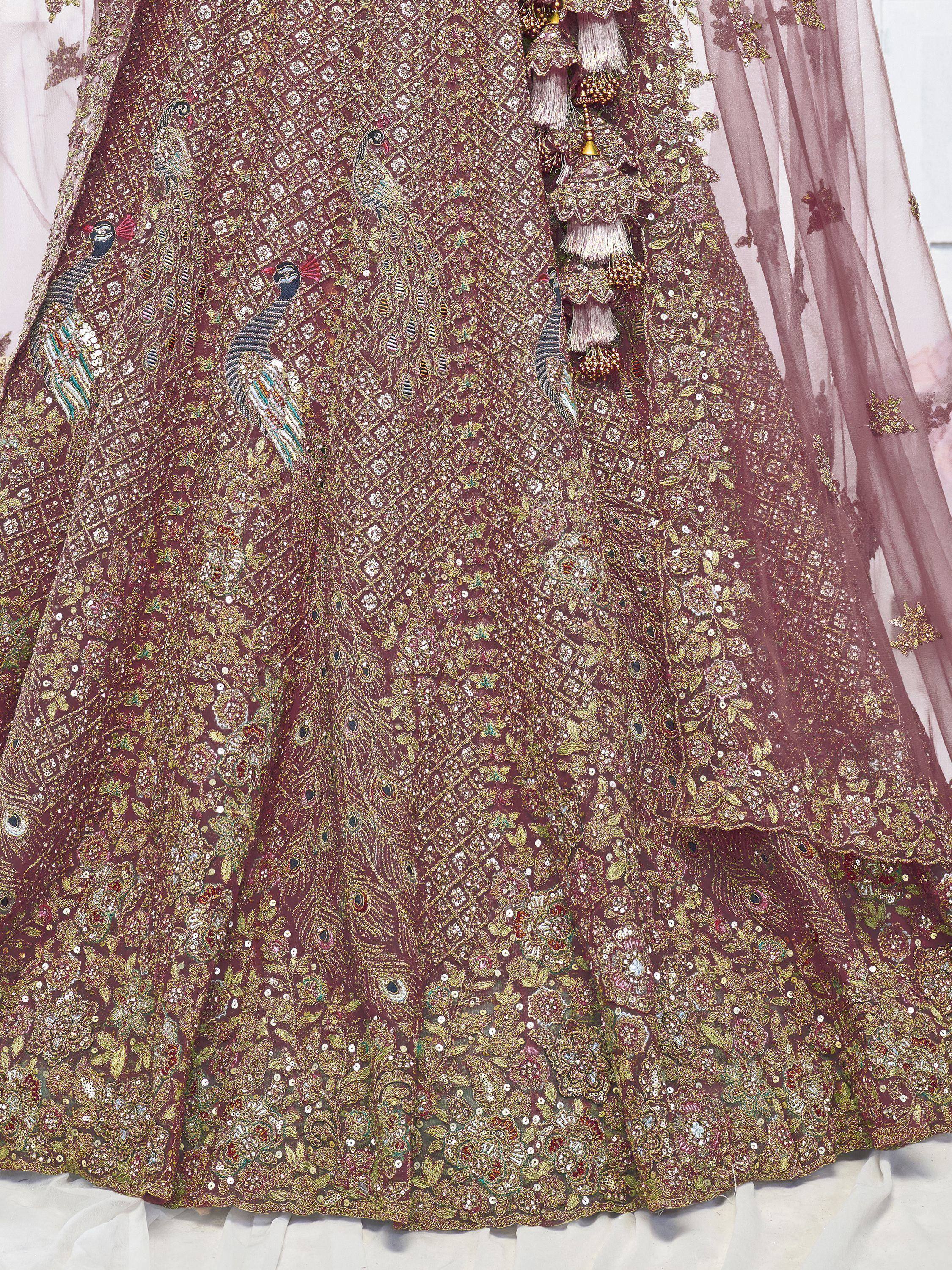 Luxury maroon lehenga with peacock embroidery, gold sequins, and floral motifs for Indian weddings