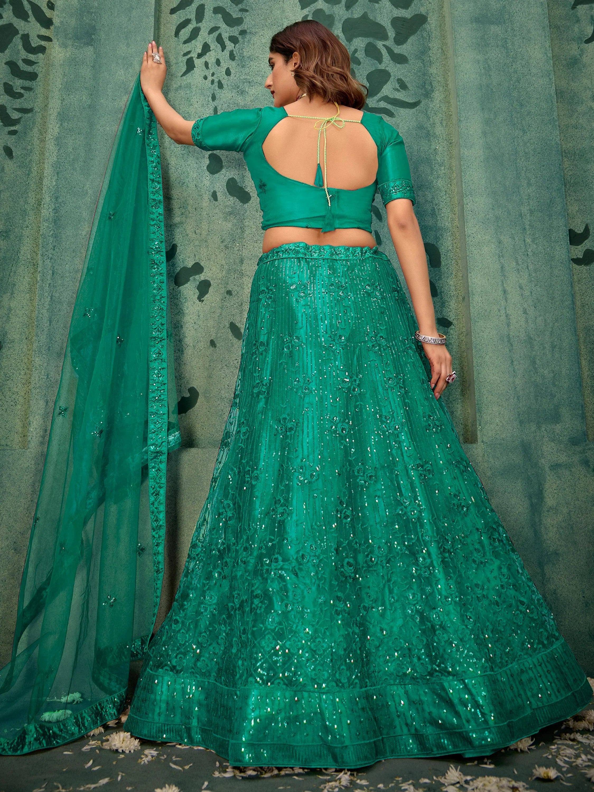 Emerald green designer lehenga choli with sequin embroidery and back tie blouse, perfect for Indian ethnic wear.