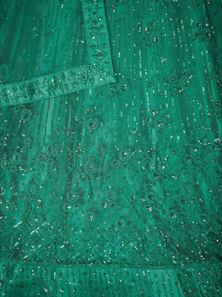 Emerald green ethnic gown with intricate sequin embroidery and floral patterns