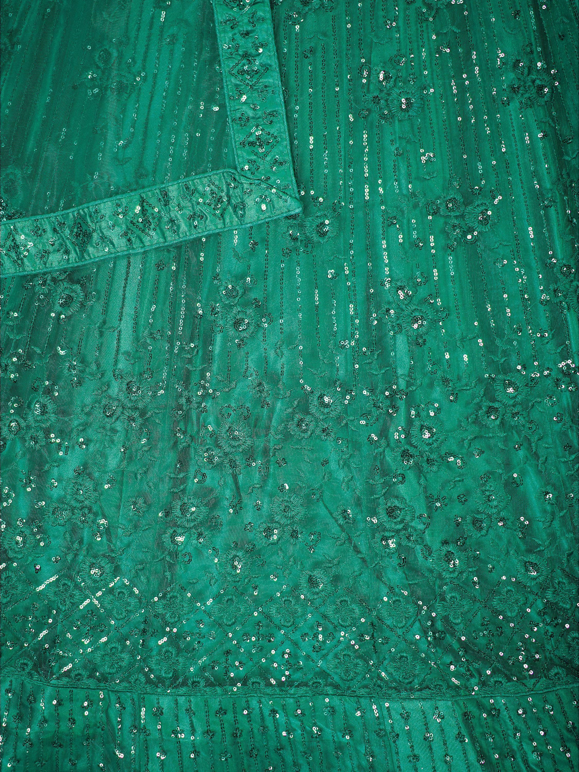 Emerald green ethnic gown with intricate sequin embroidery and floral patterns