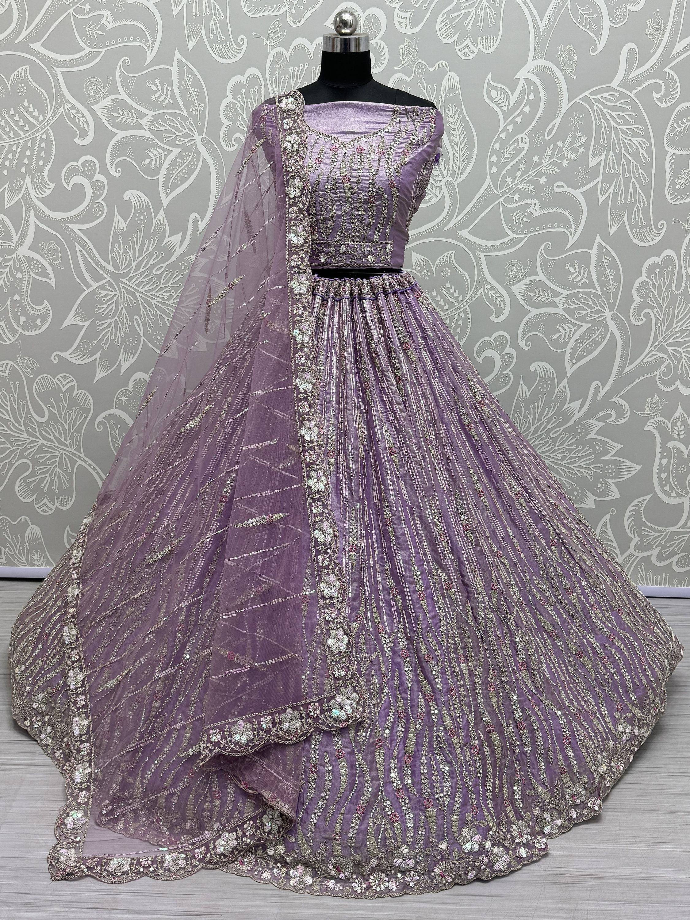 Lavender designer lehenga choli with heavy embroidery and net dupatta, perfect for weddings and festivals