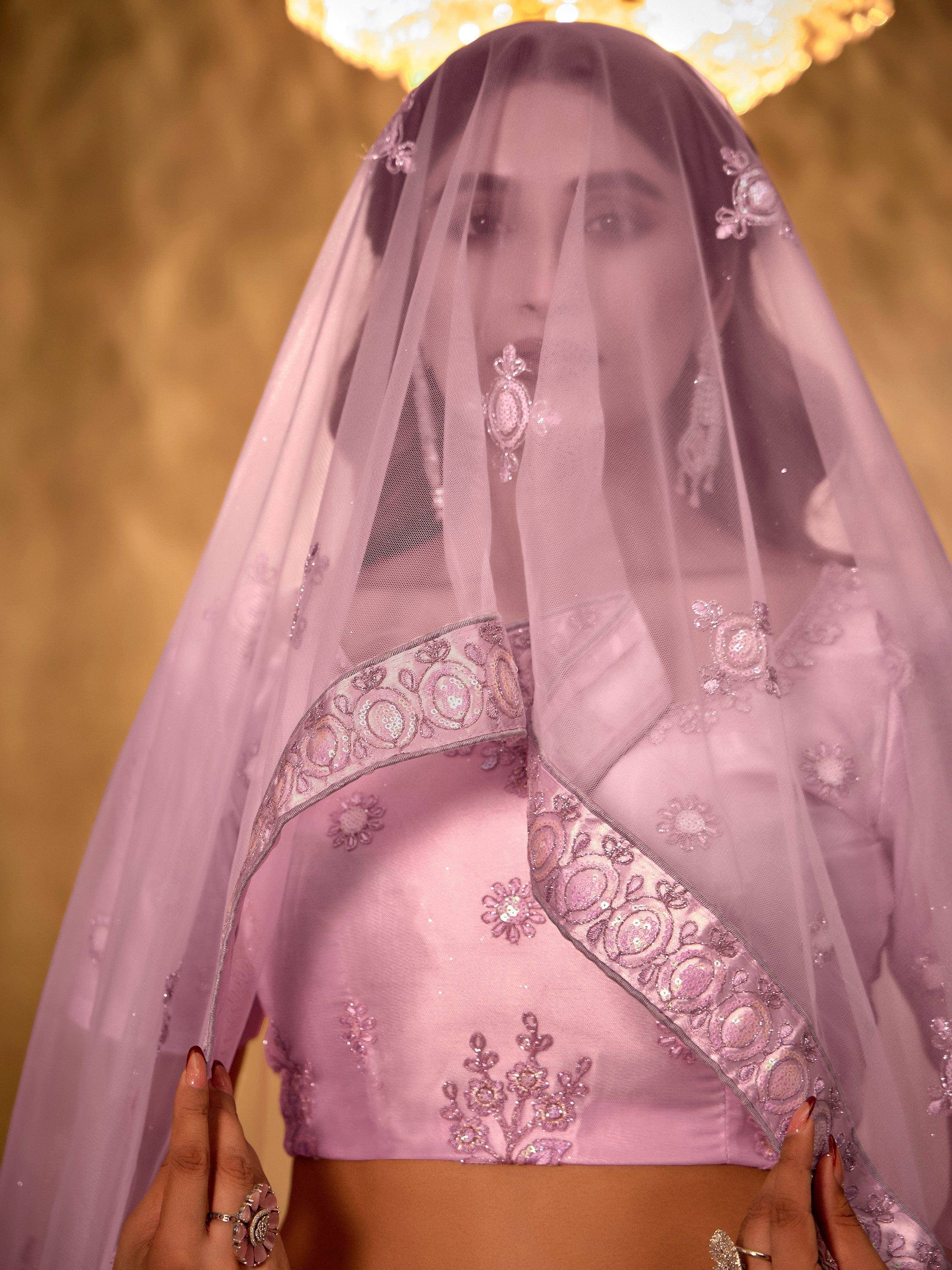 Elegant lavender lehenga choli with embroidered dupatta, perfect for Indian weddings and festive occasions.