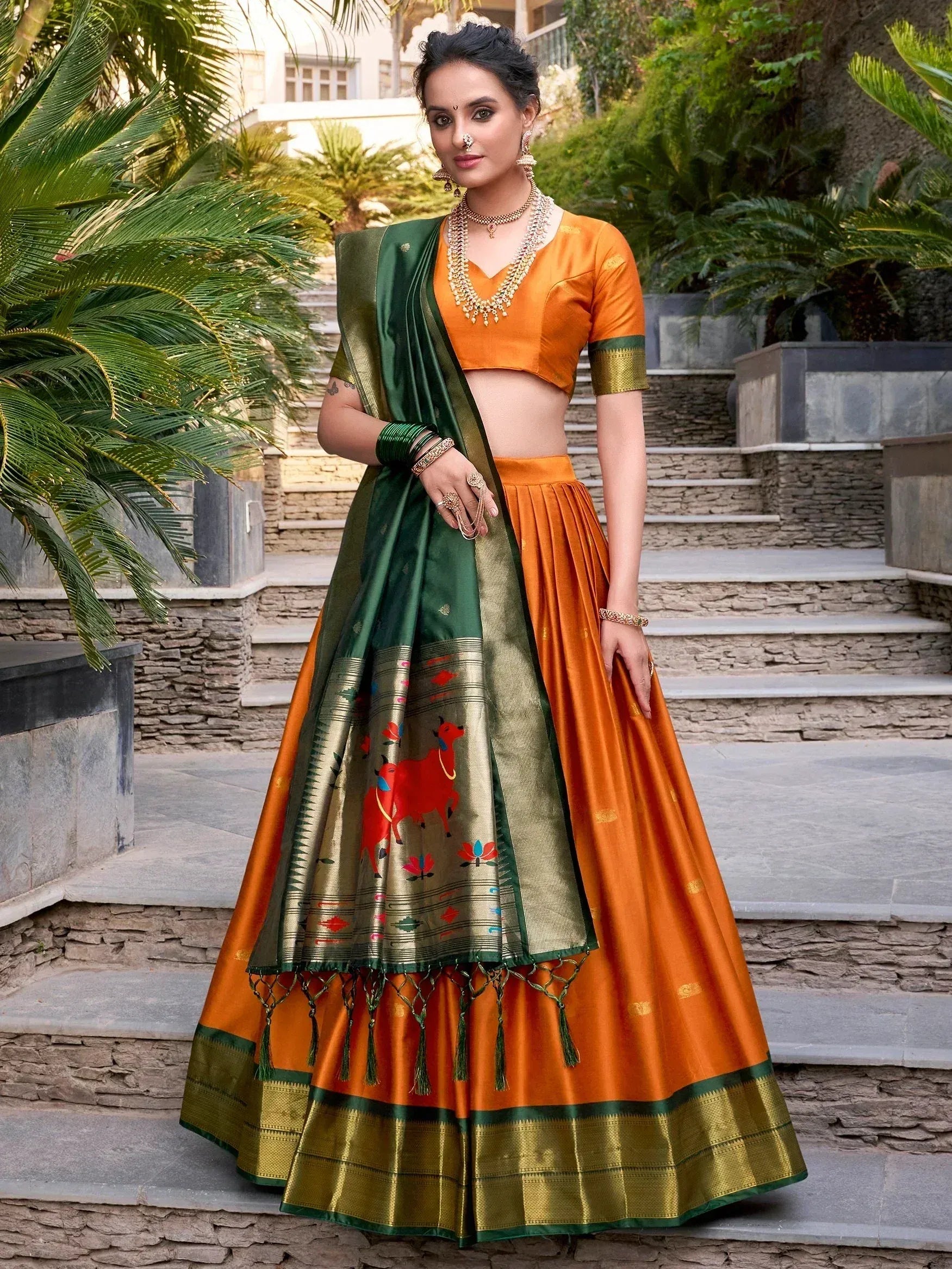 Orange and green designer lehenga choli with printed dupatta, perfect for Indian ethnic wear occasions