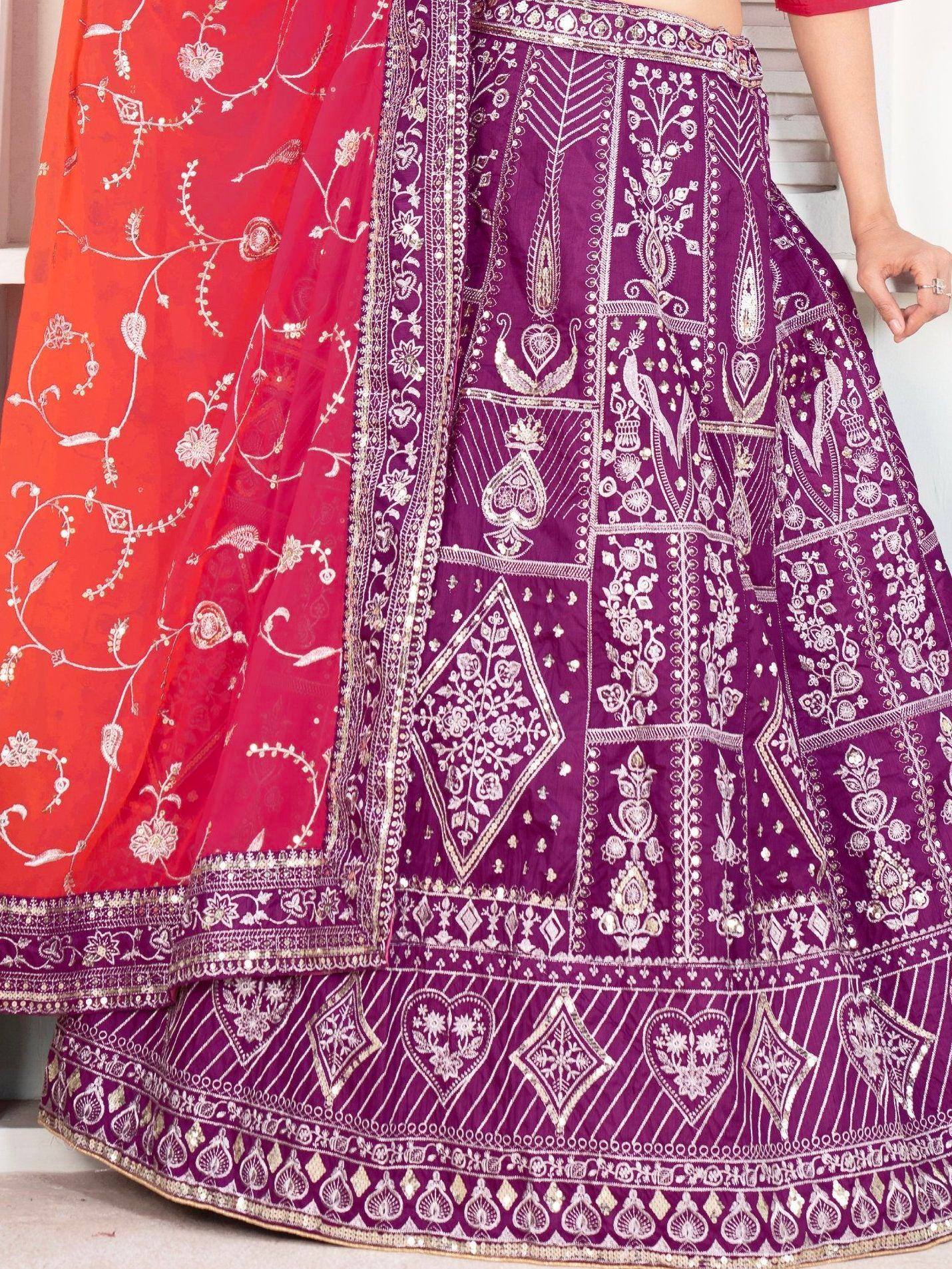 Purple and red embroidered lehenga choli with intricate floral and geometric patterns, perfect for Indian ethnic wear.