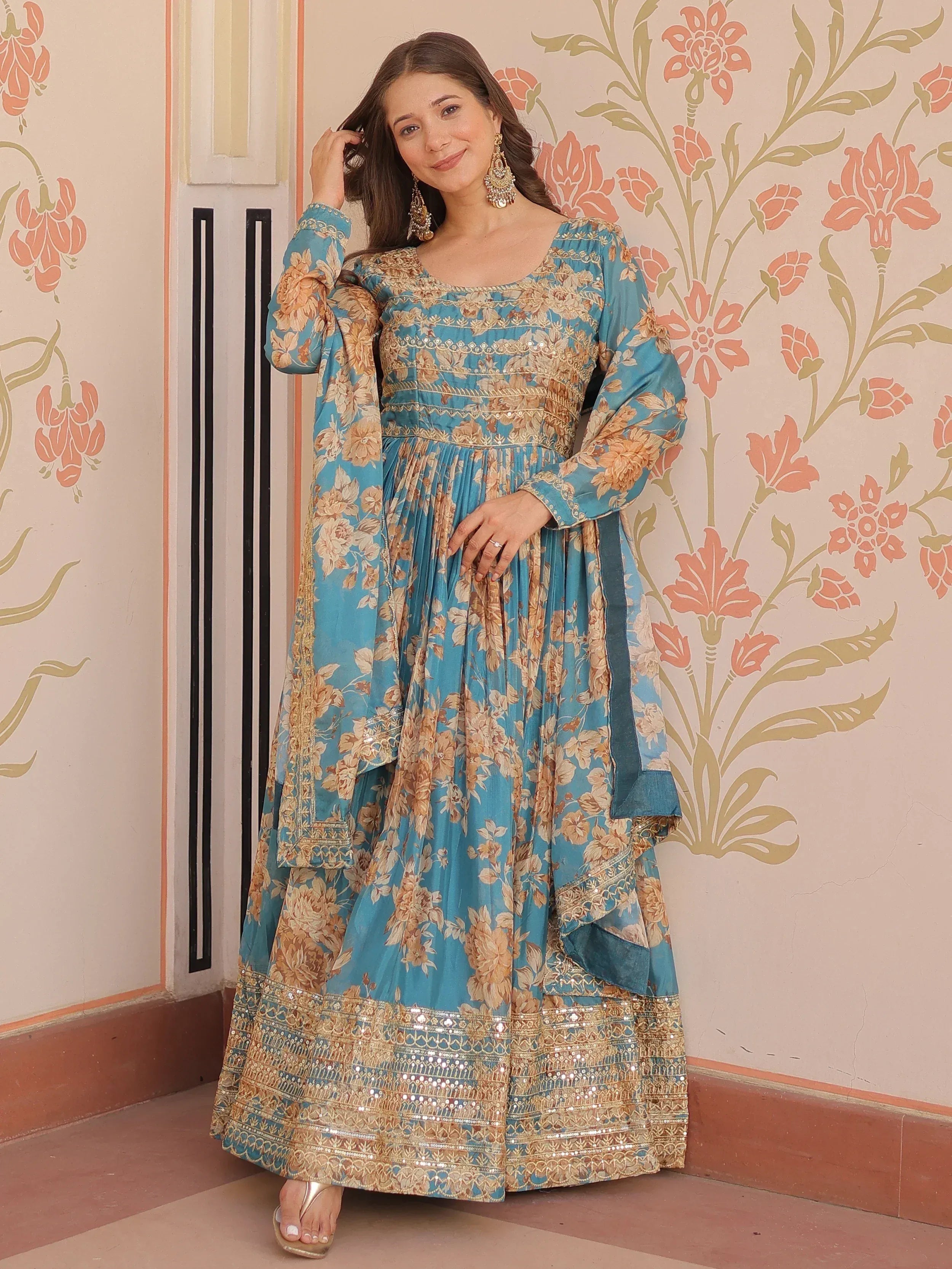 Blue floral ethnic gown with gold embroidery, perfect for Indian festive occasions and weddings