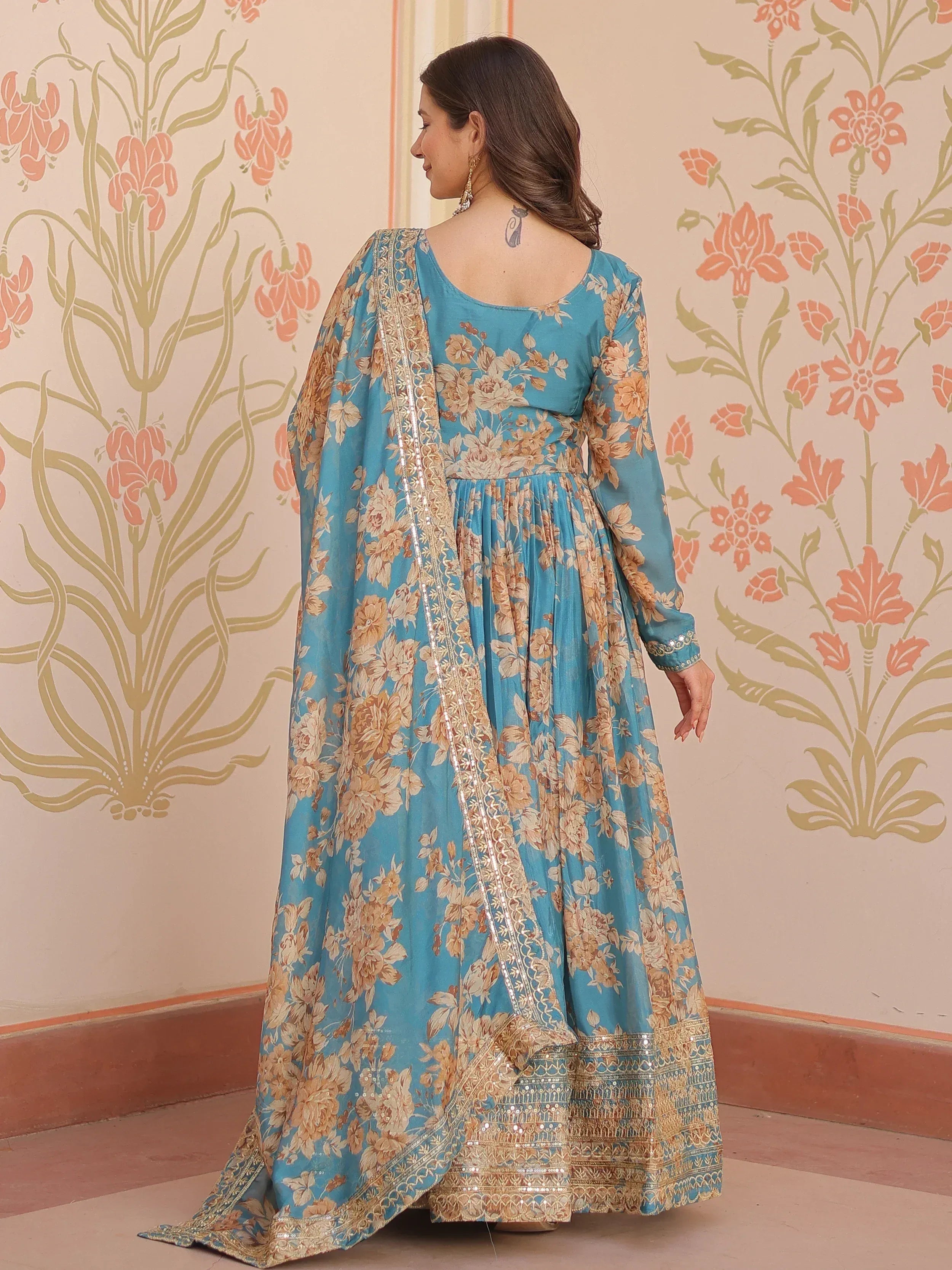 Blue floral printed Anarkali suit with gold embroidery and sequin detailing, ethnic Indian wear