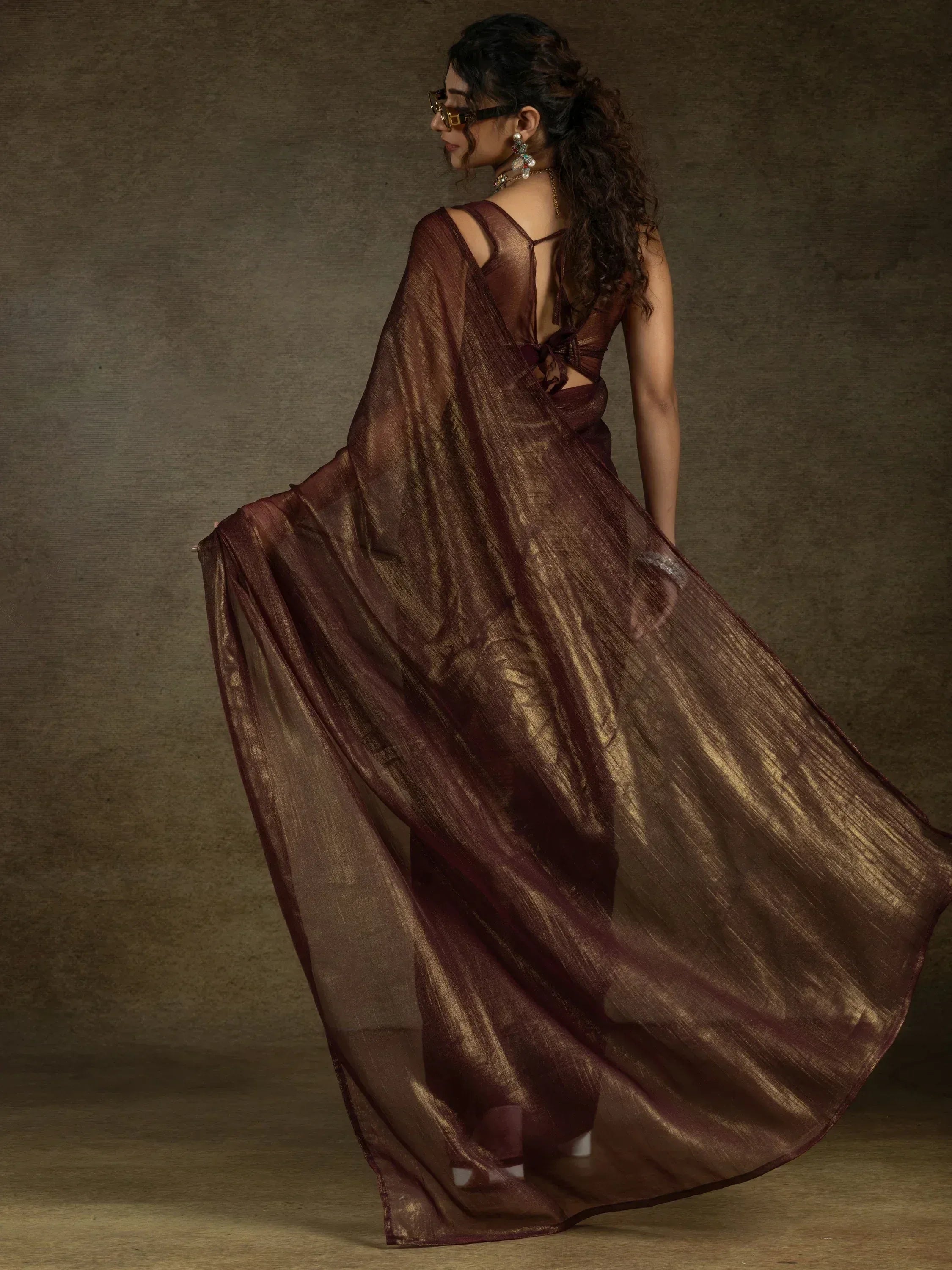 Elegant maroon sheer saree with golden sheen, backless blouse, perfect for Indian ethnic occasions