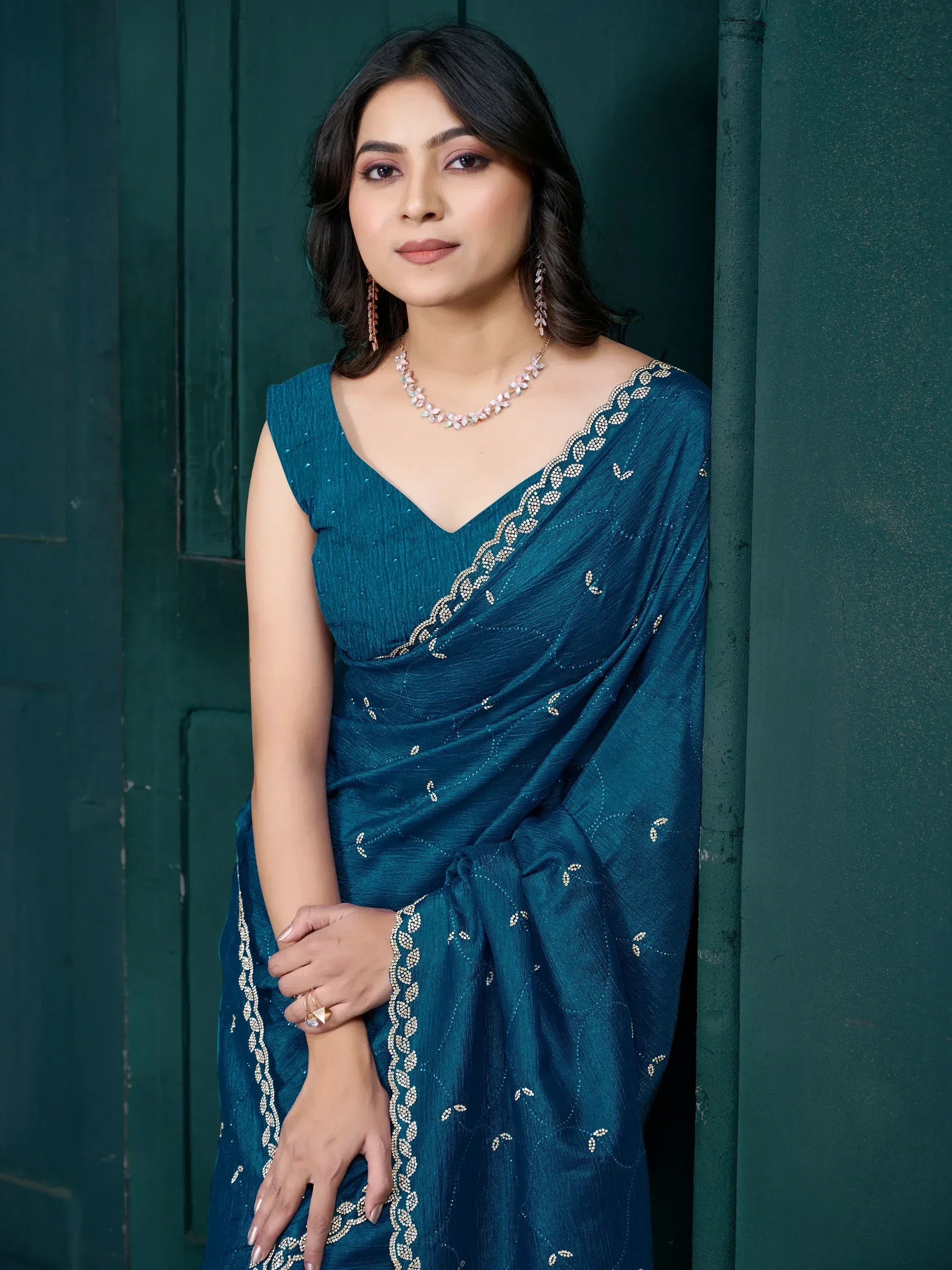Teal saree with gold embroidery, perfect for Indian ethnic wear and festive occasions.
