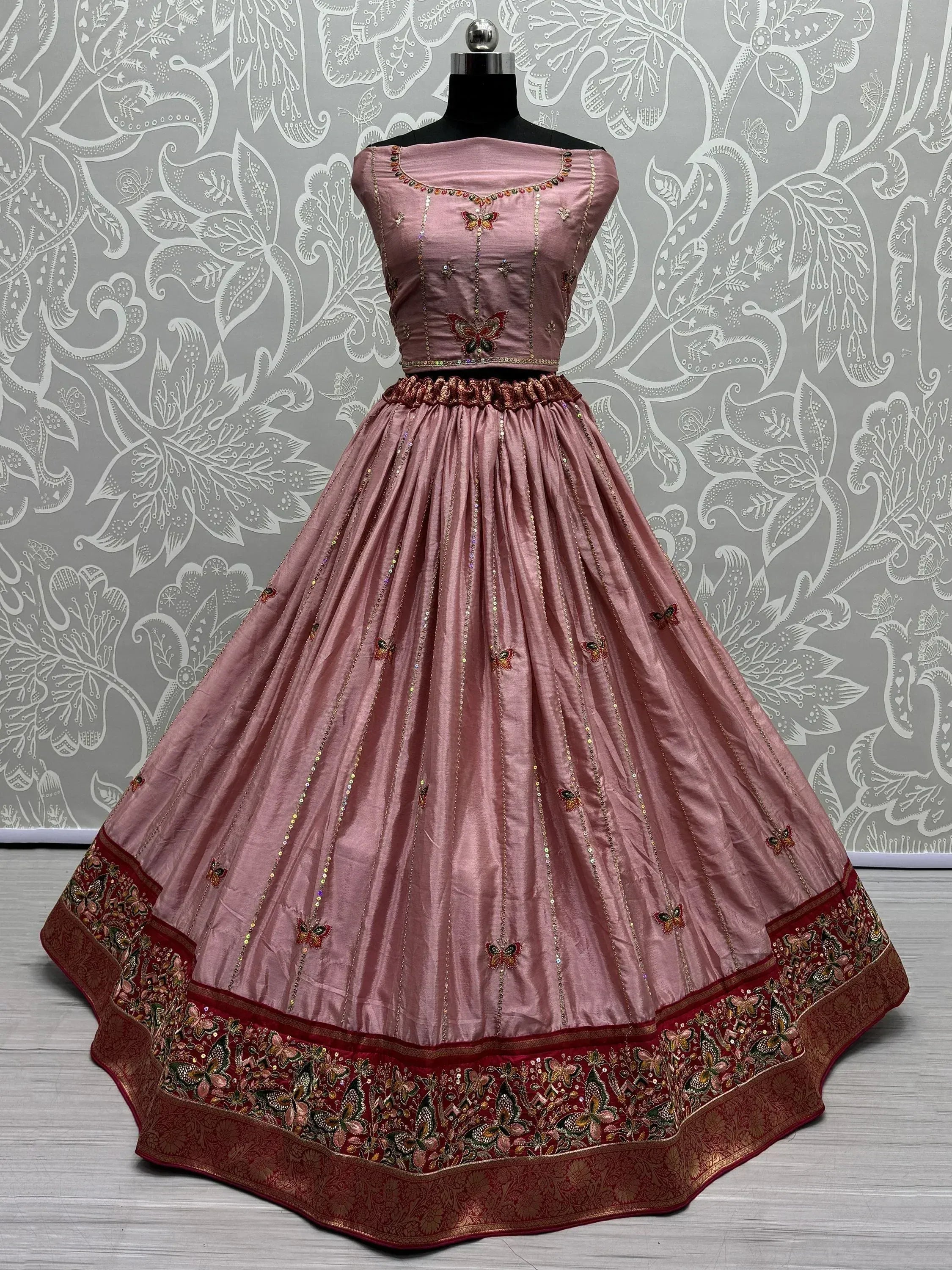 Pink designer lehenga choli with butterfly embroidery and red border, ethnic Indian wear