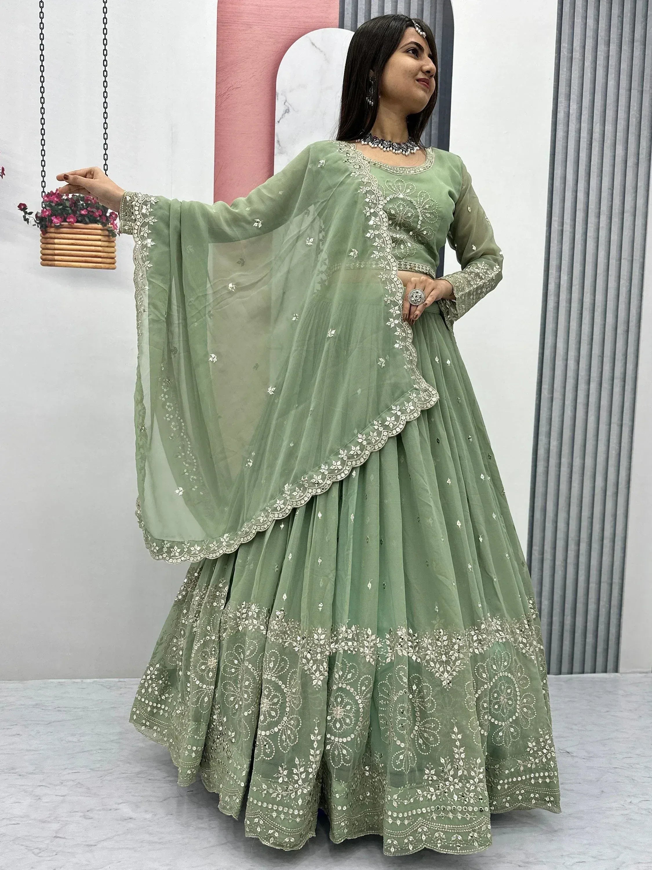 Mint green embroidered lehenga choli with sheer dupatta, perfect for Indian ethnic occasions