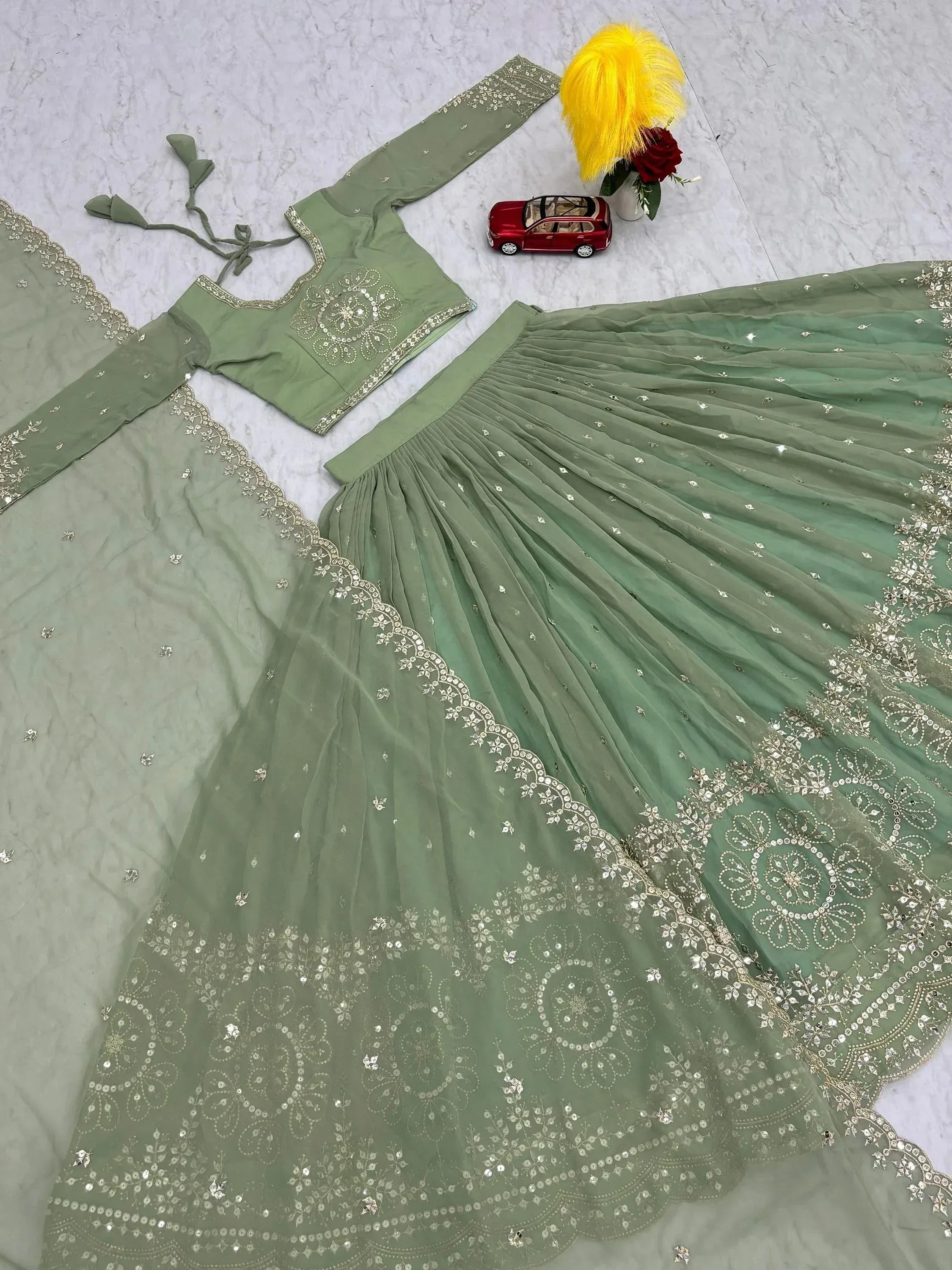 Mint green embroidered lehenga choli with sequin work, perfect for Indian ethnic wear and festive occasions.