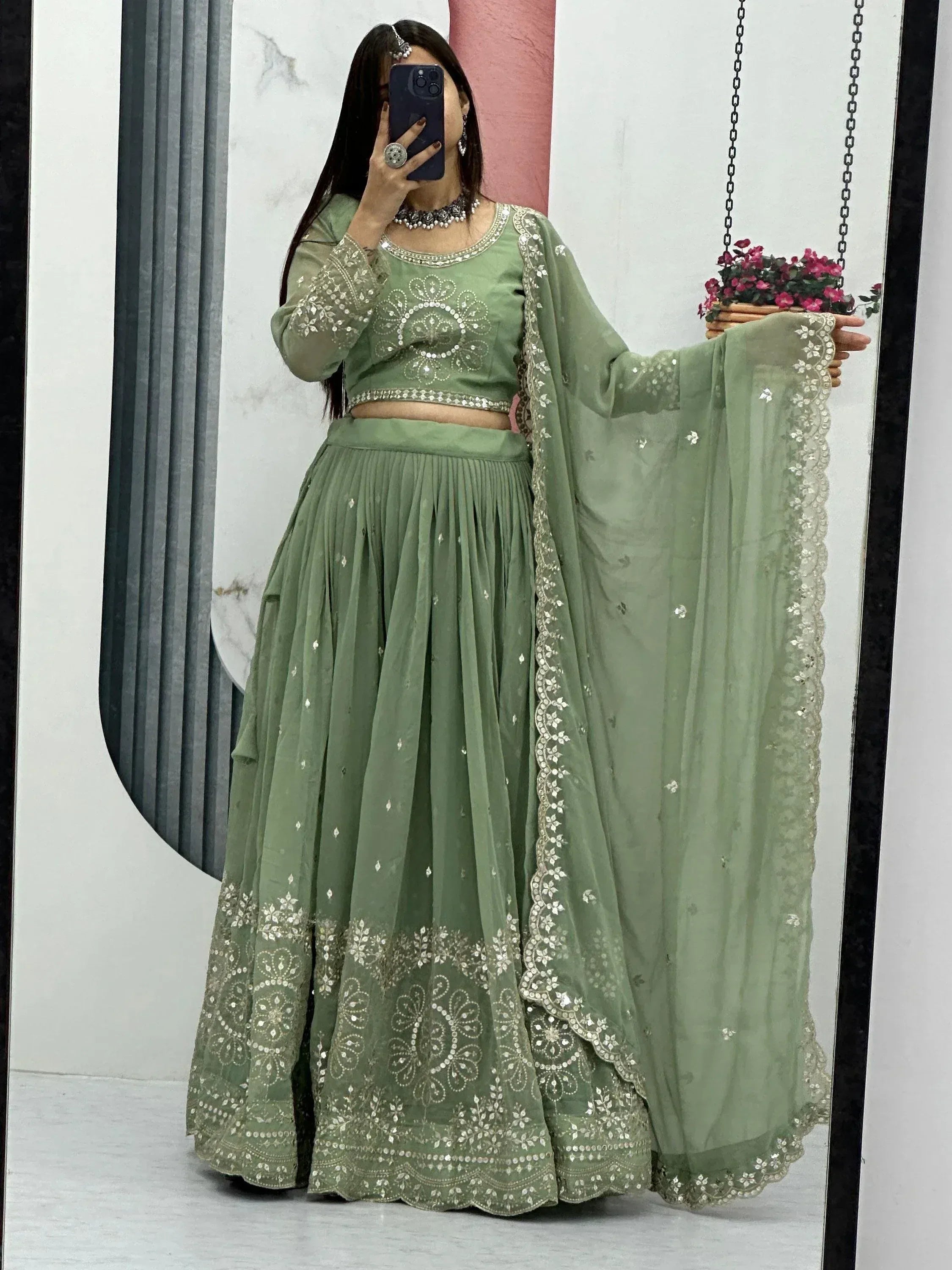 Mint green embroidered lehenga choli with mirror work, perfect for Indian ethnic wear occasions
