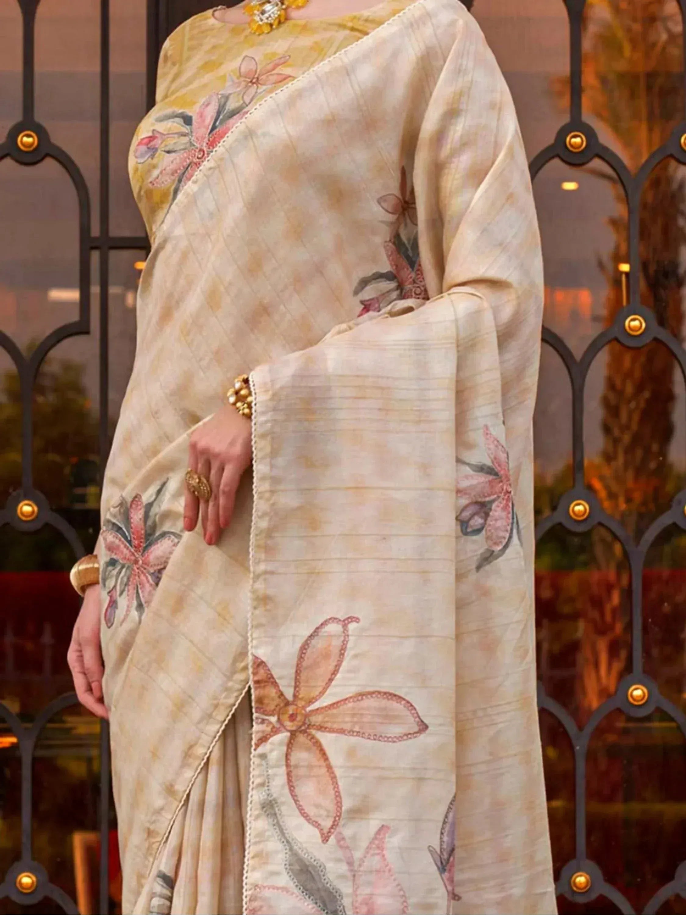 Elegant beige saree with floral embroidery, perfect for Indian ethnic wear occasions