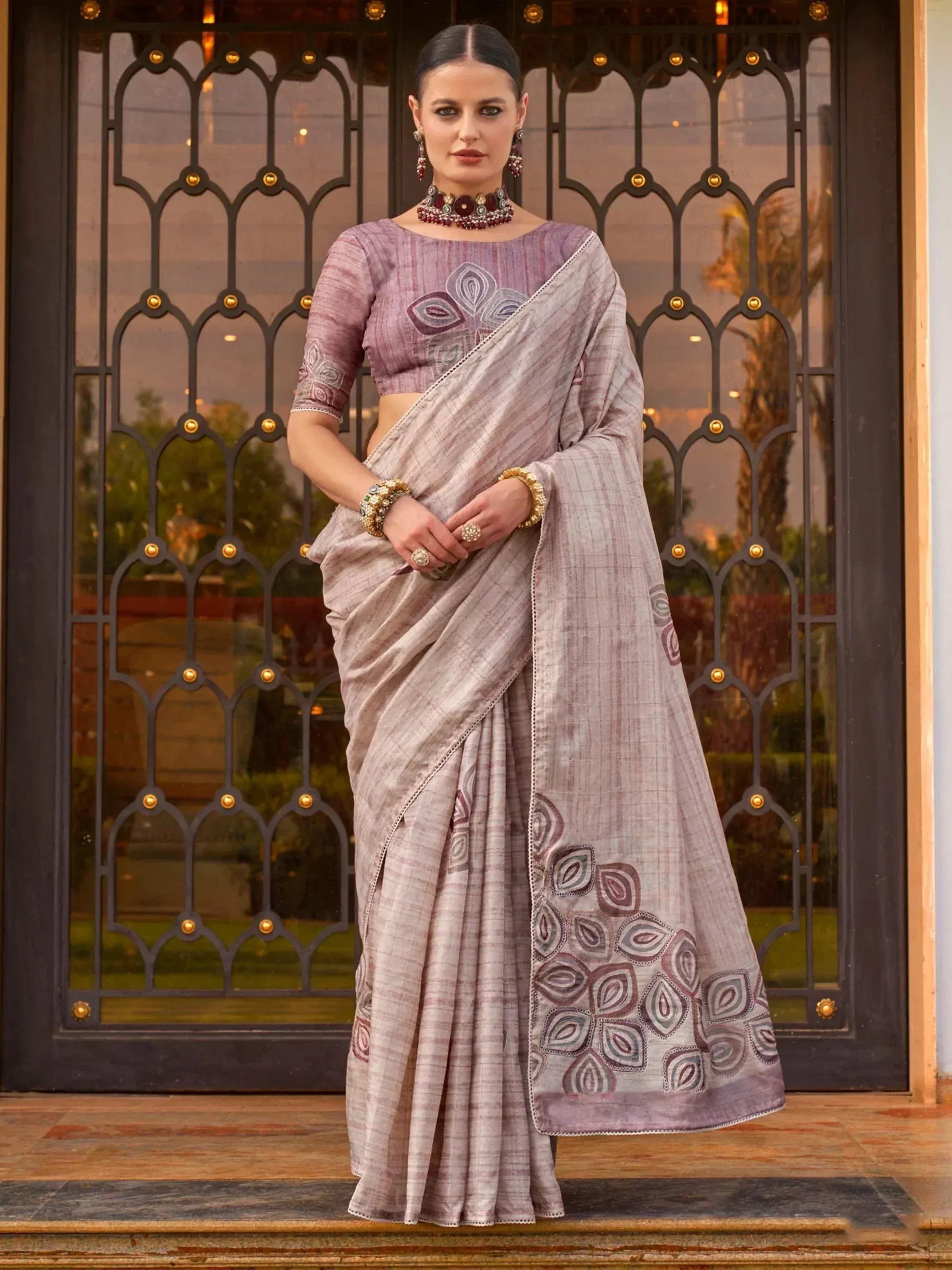 Elegant lavender ethnic saree with floral embroidery and matching blouse, perfect for Indian occasions.