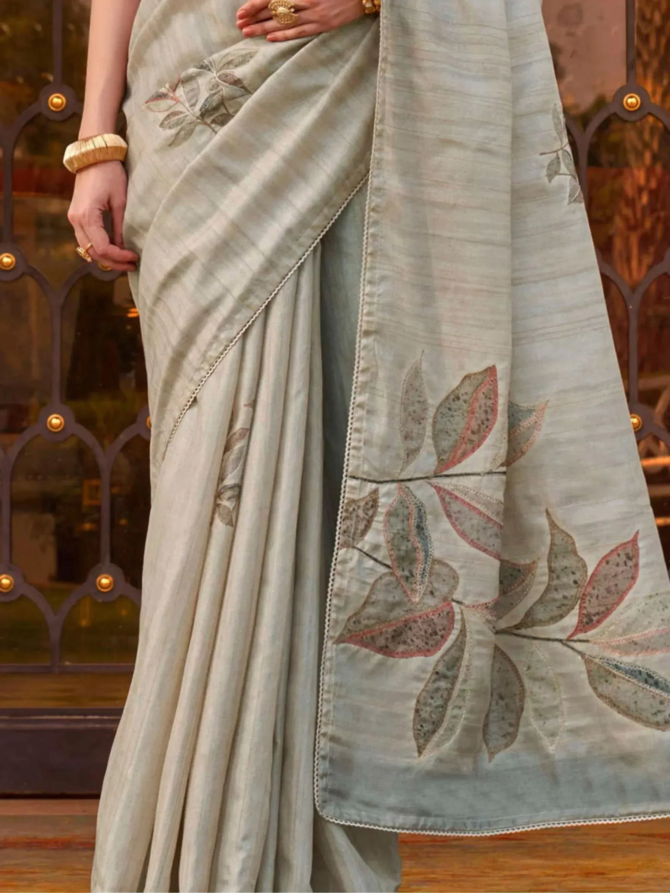 Elegant grey saree with leaf embroidery, perfect for Indian ethnic wear and designer occasions.