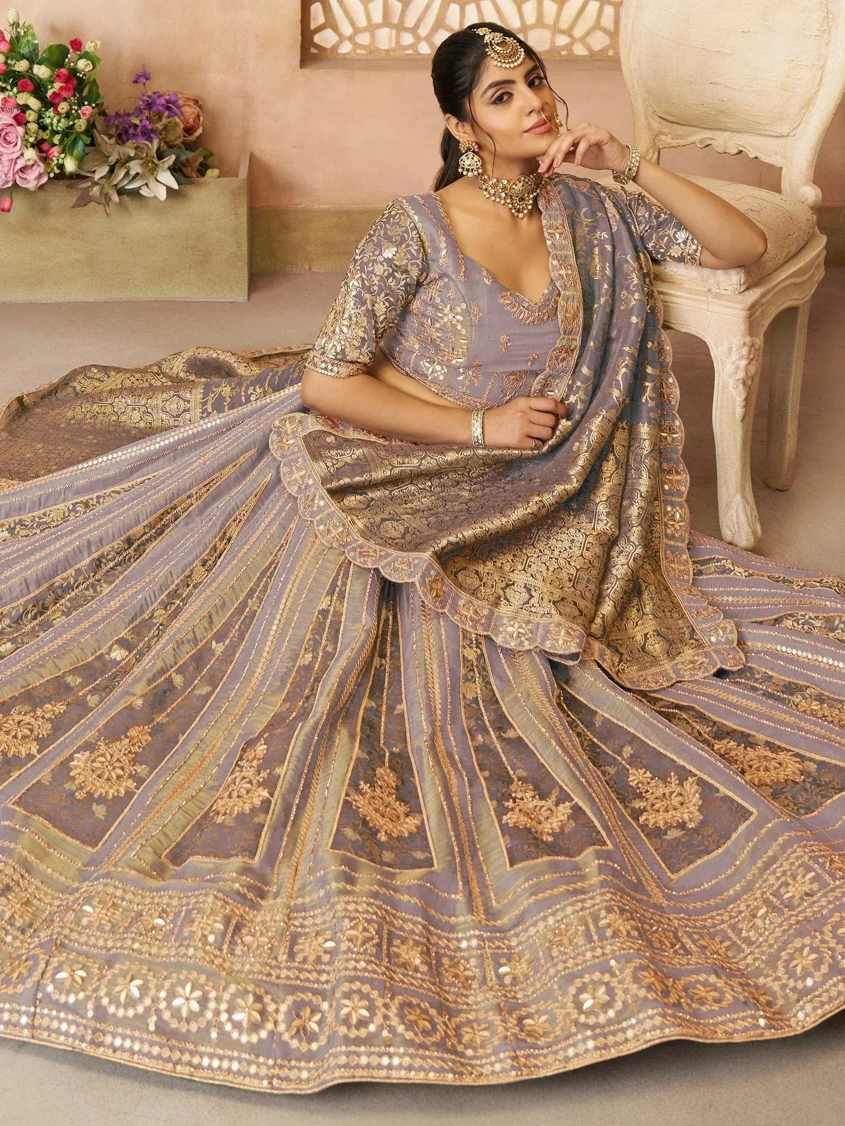 Elegant lavender lehenga choli with gold embroidery, perfect for Indian weddings and festive occasions.