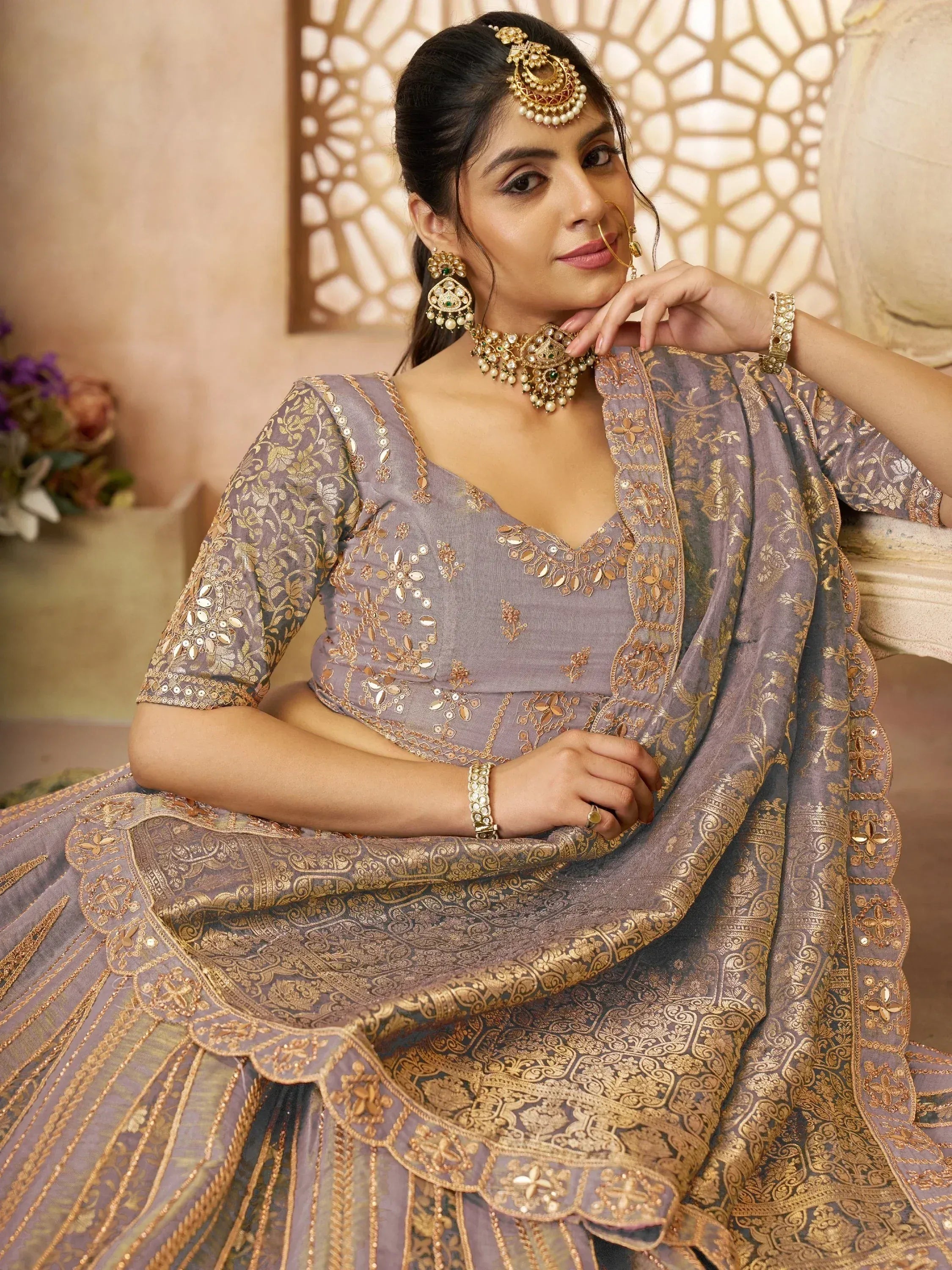 Elegant lavender lehenga choli with gold embroidery, perfect for Indian weddings and festive occasions.