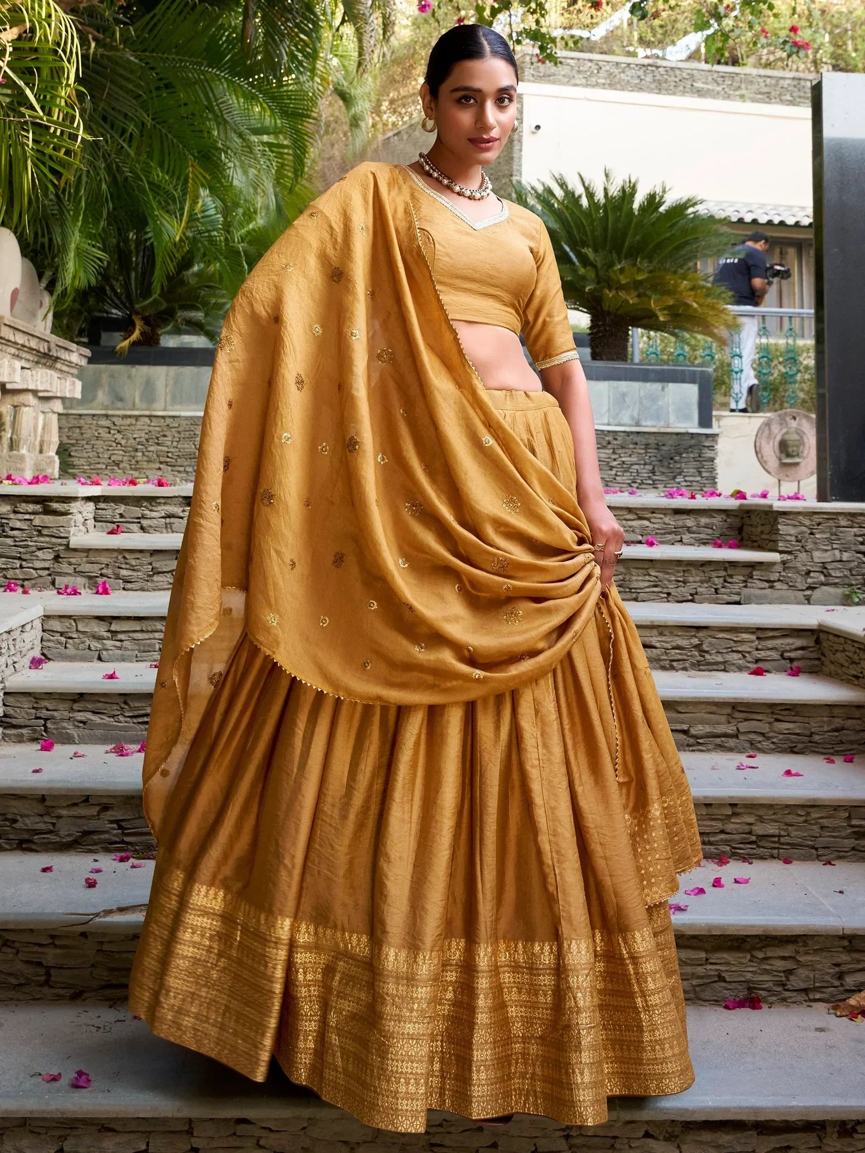 Mustard yellow lehenga choli with gold embroidery, perfect for Indian ethnic occasions and weddings.