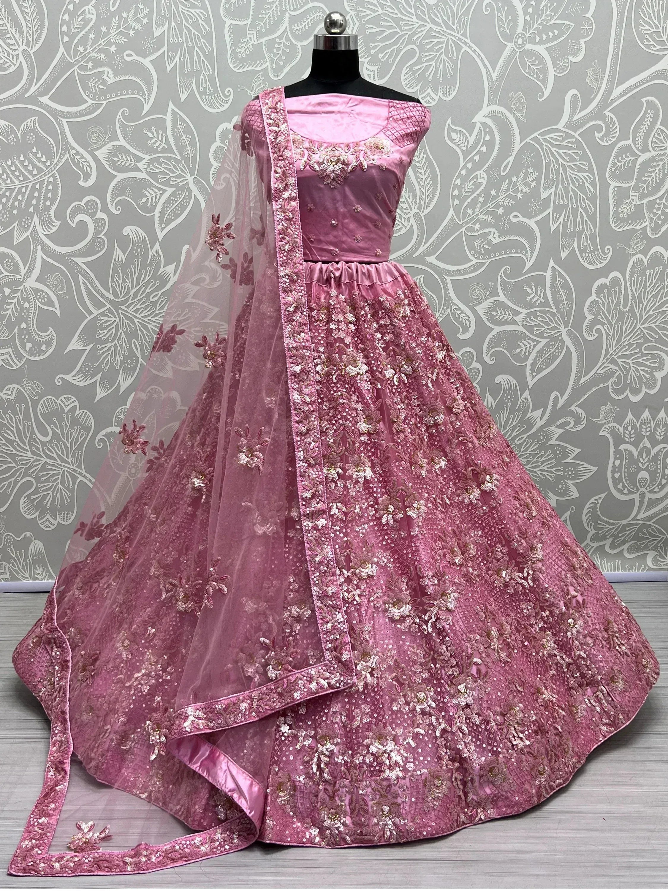 Pink designer lehenga choli with floral embroidery and sequins, perfect for Indian ethnic occasions
