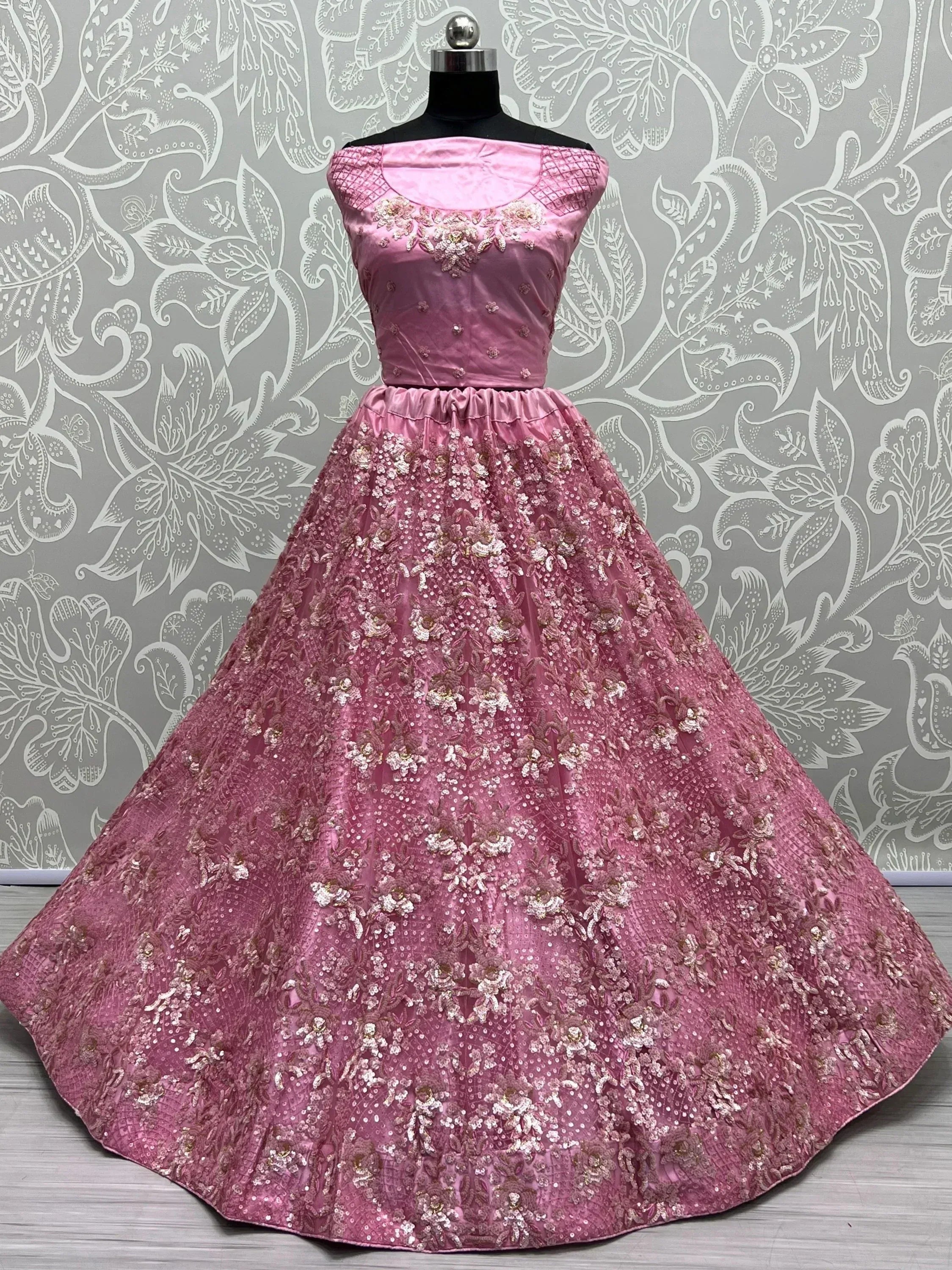 Pink floral embroidered ethnic gown with off-shoulder design, perfect for Indian weddings and parties