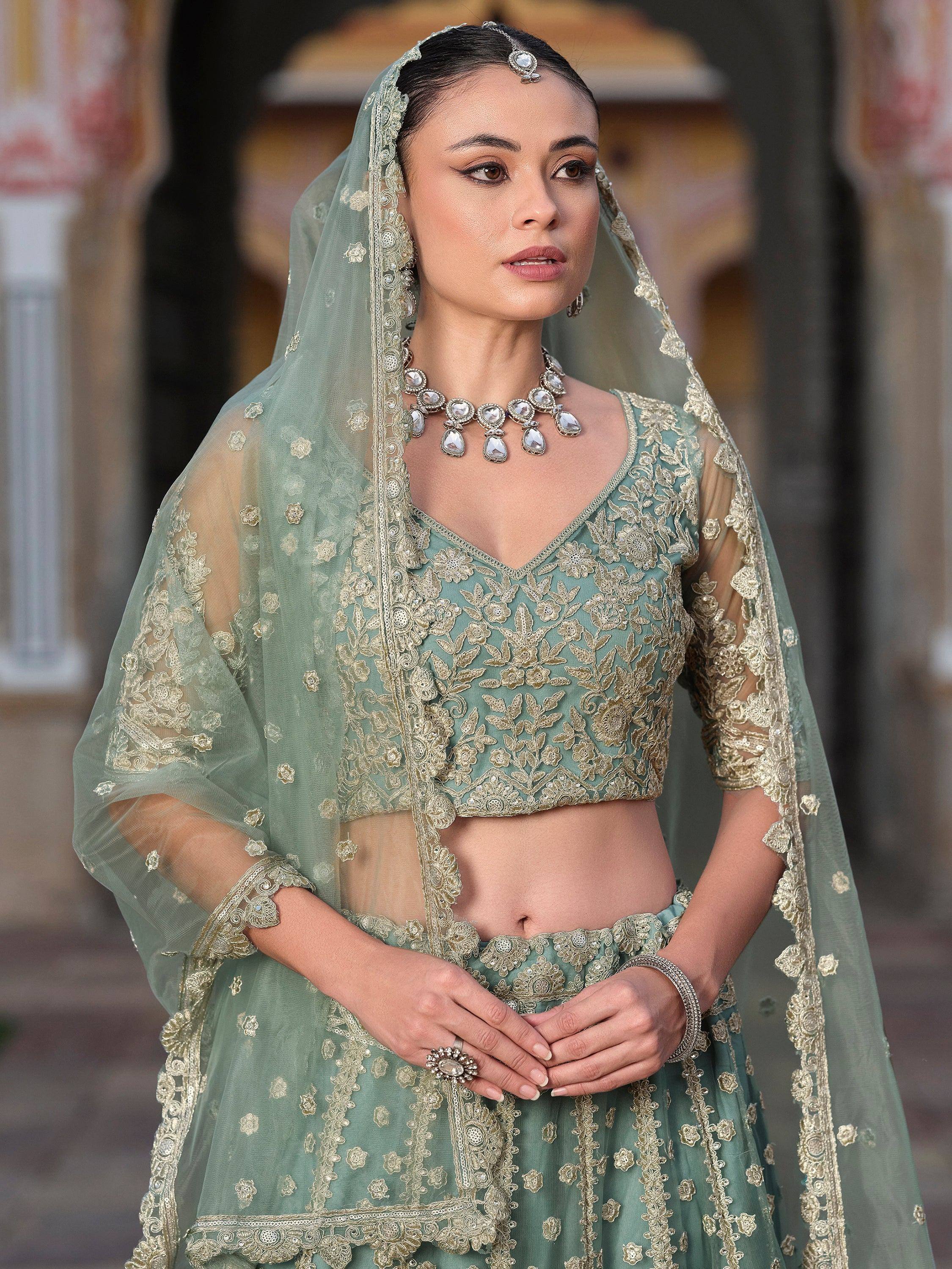 Mint green designer lehenga choli with gold embroidery and matching dupatta for Indian weddings
