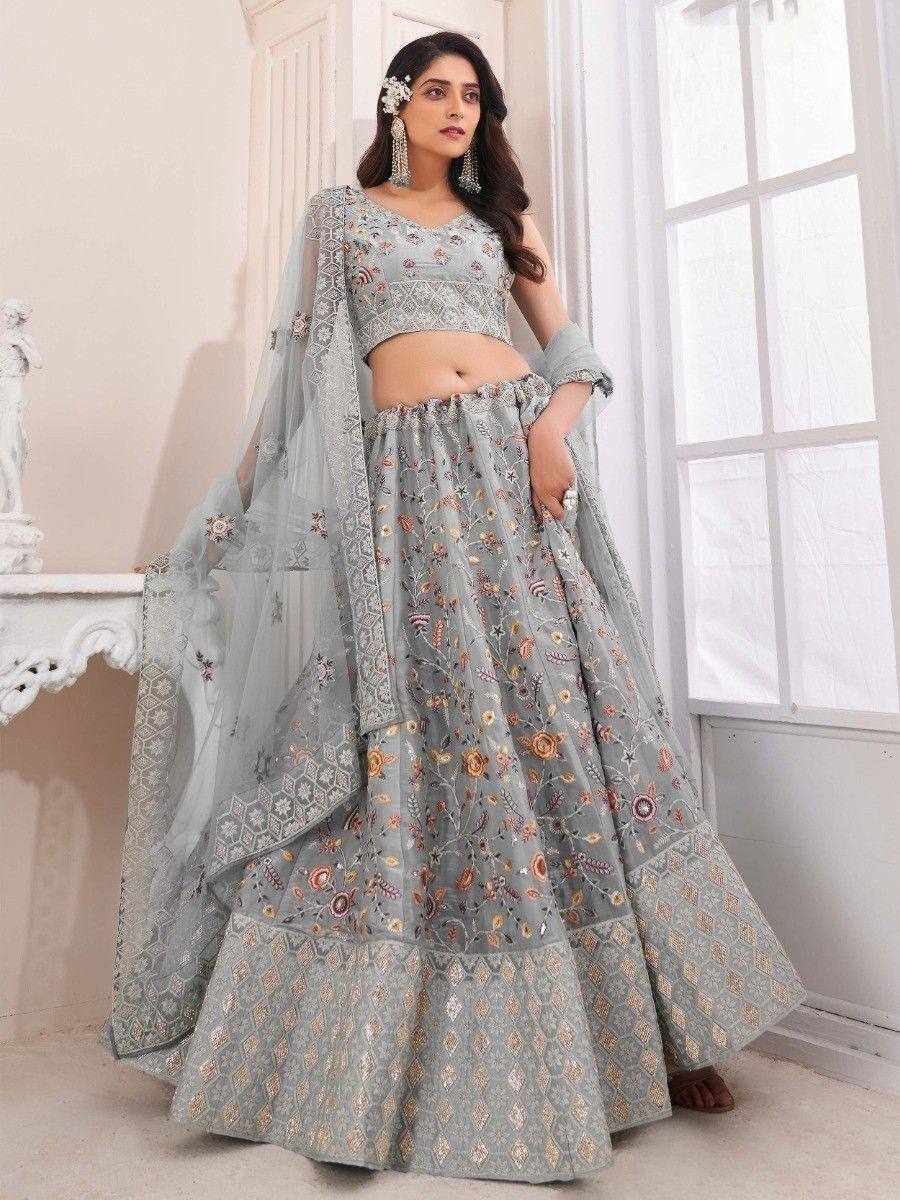 Light grey embroidered lehenga choli with floral motifs and sheer dupatta, perfect for Indian ethnic occasions.