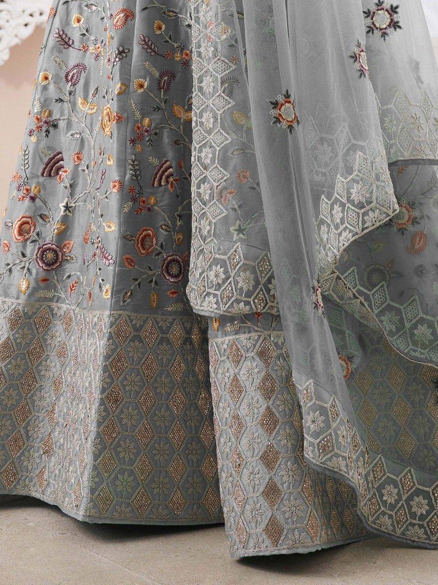 Grey embroidered lehenga choli with floral and geometric patterns, perfect for Indian ethnic wear.