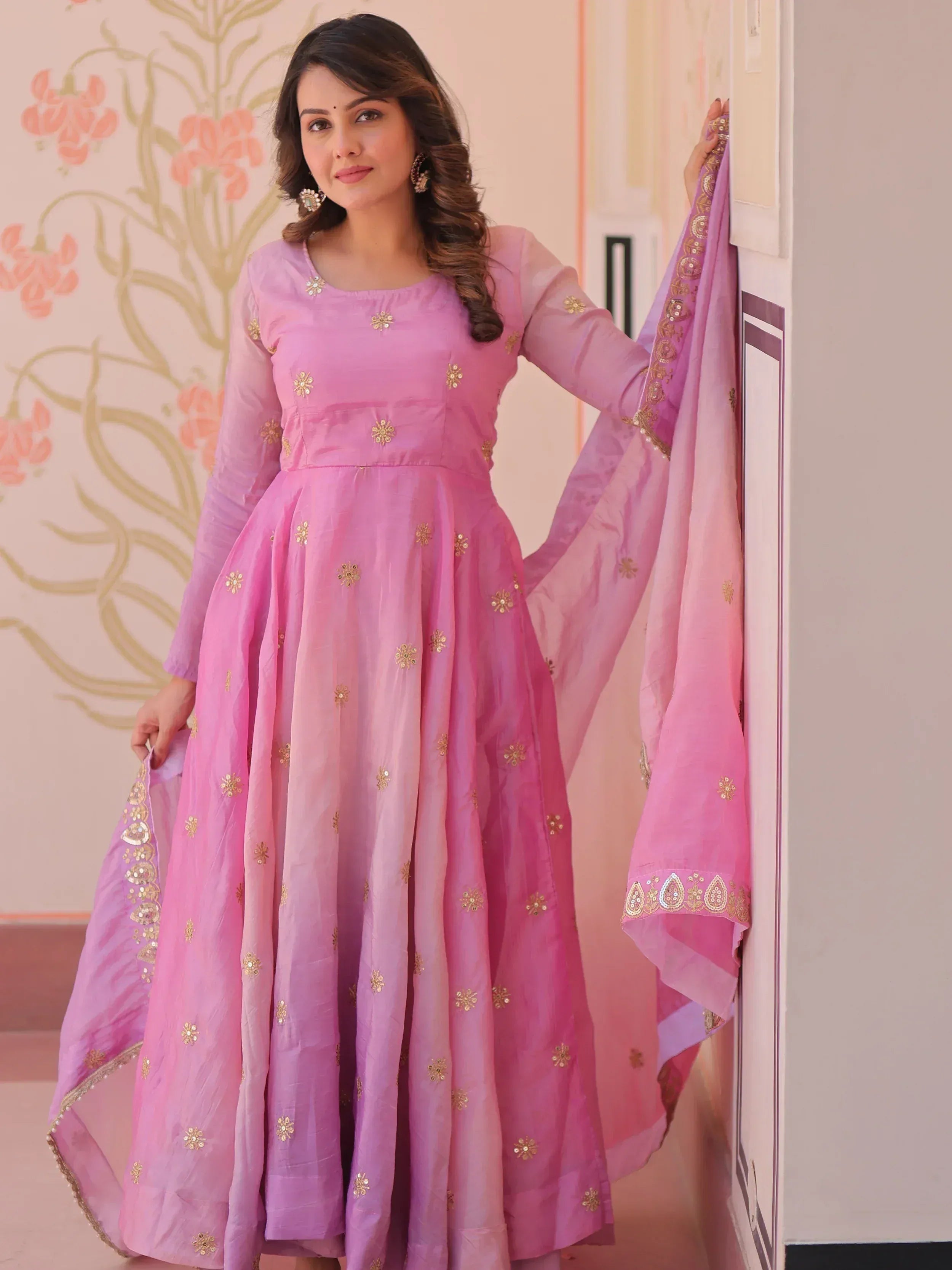 Pink embroidered Anarkali suit with gold floral motifs and matching dupatta, ideal for Indian ethnic wear occasions