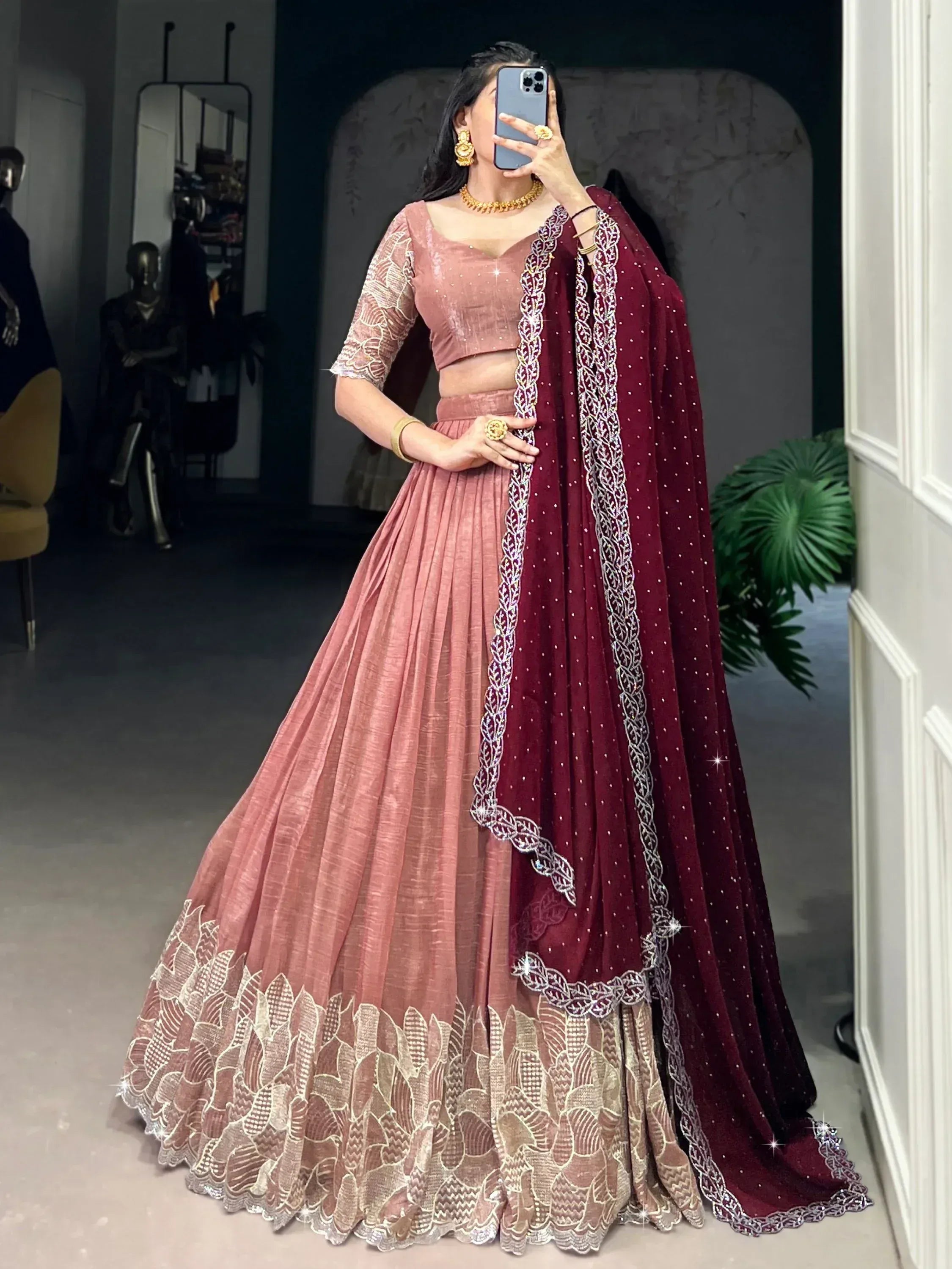 Dusty pink lehenga choli with maroon dupatta, gold embroidery, and sequin detailing for Indian ethnic wear