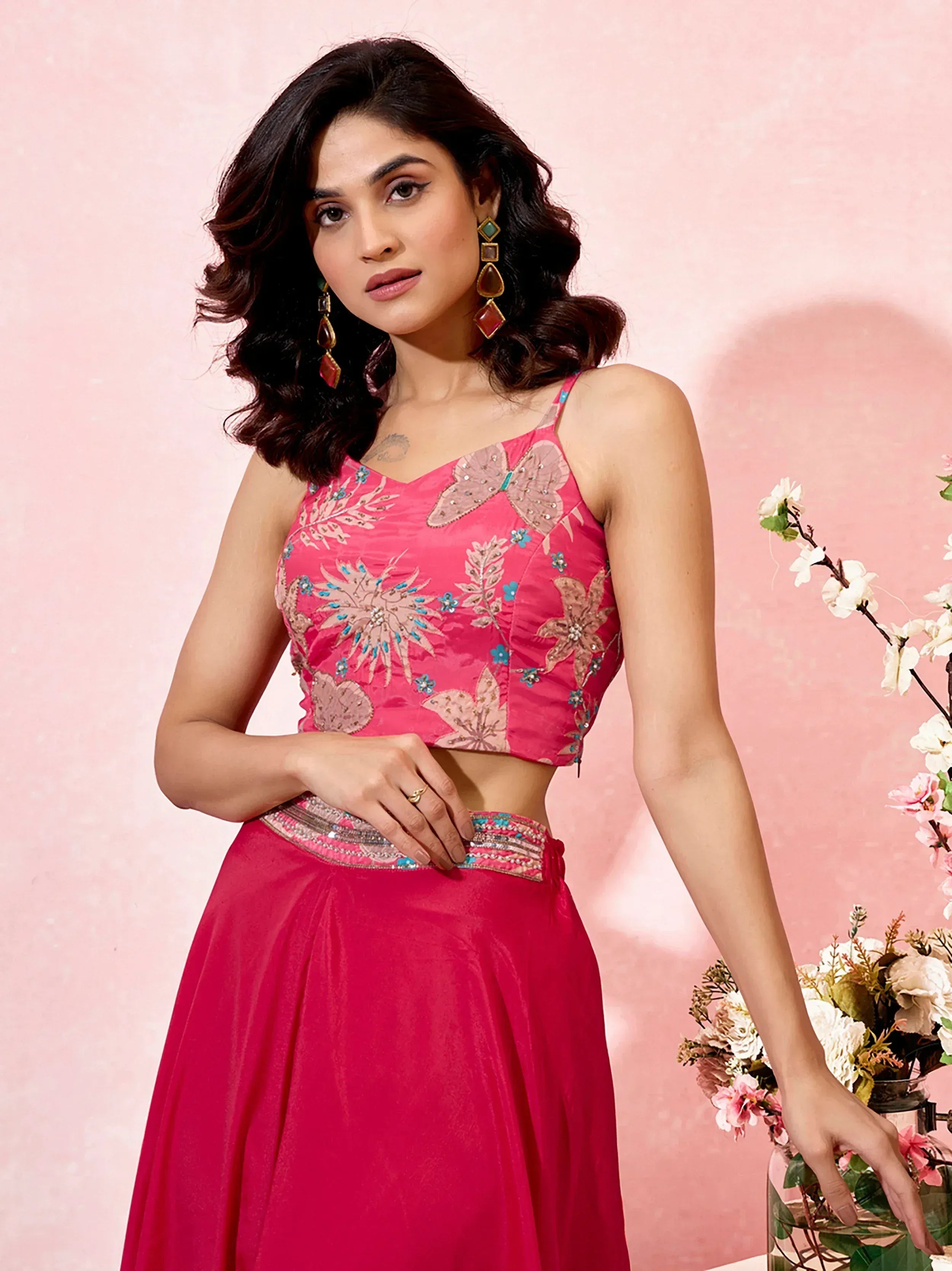 Pink embroidered lehenga choli with floral and butterfly motifs, perfect for Indian ethnic wear