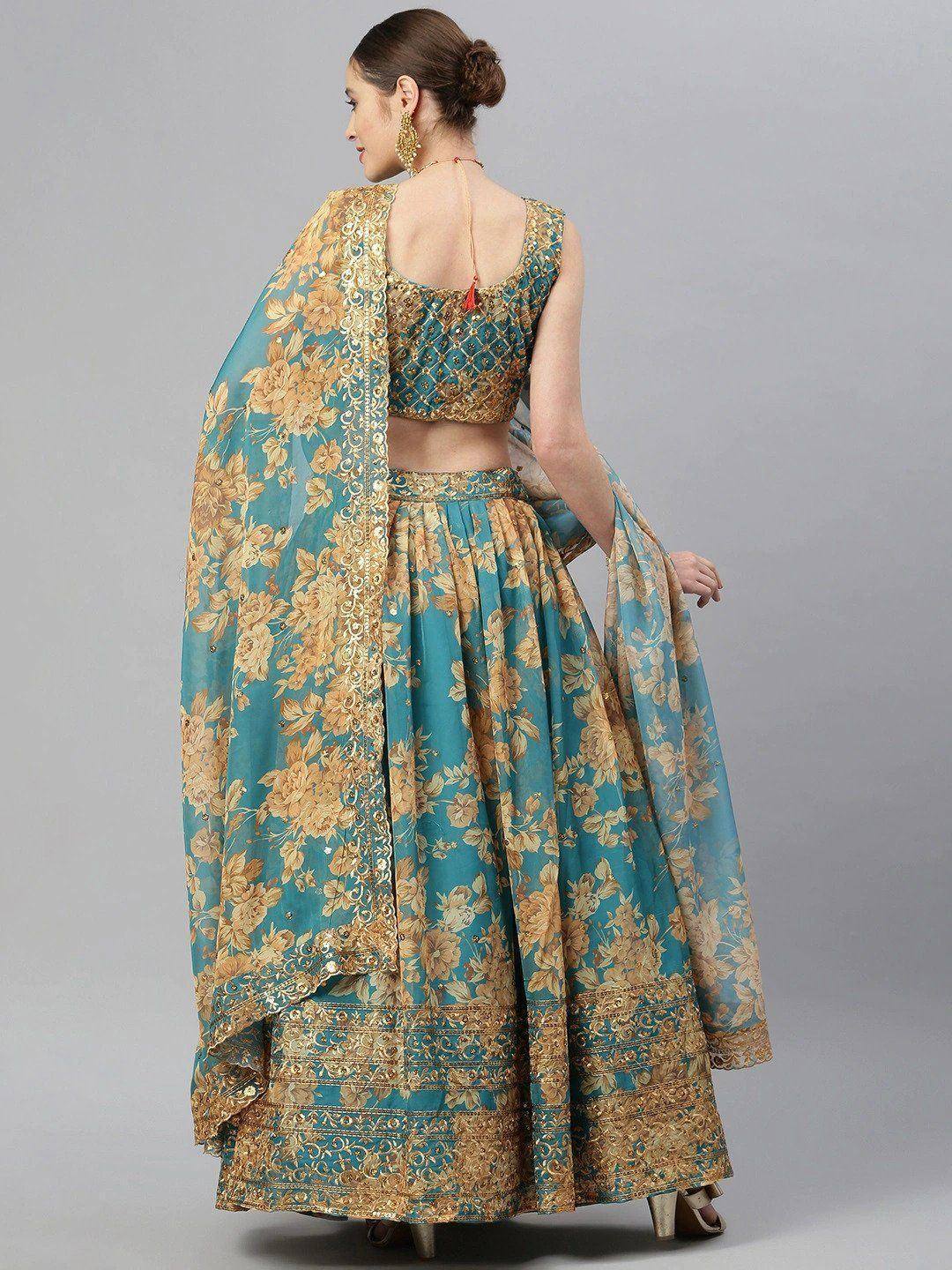 Teal and gold floral lehenga choli with embroidered dupatta, perfect for Indian ethnic wear occasions