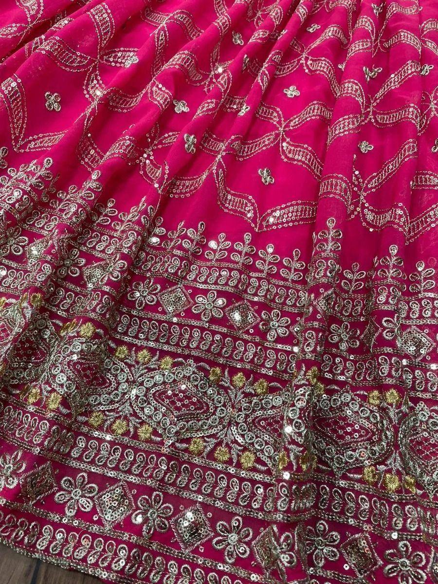 Fuchsia ethnic lehenga with silver and gold embroidery, sequins, and floral patterns