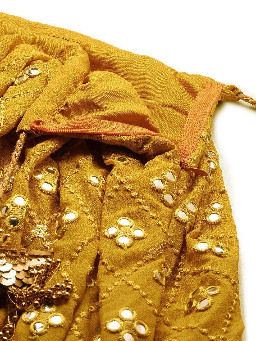 Mustard yellow ethnic lehenga with mirror work and gold embroidery detail