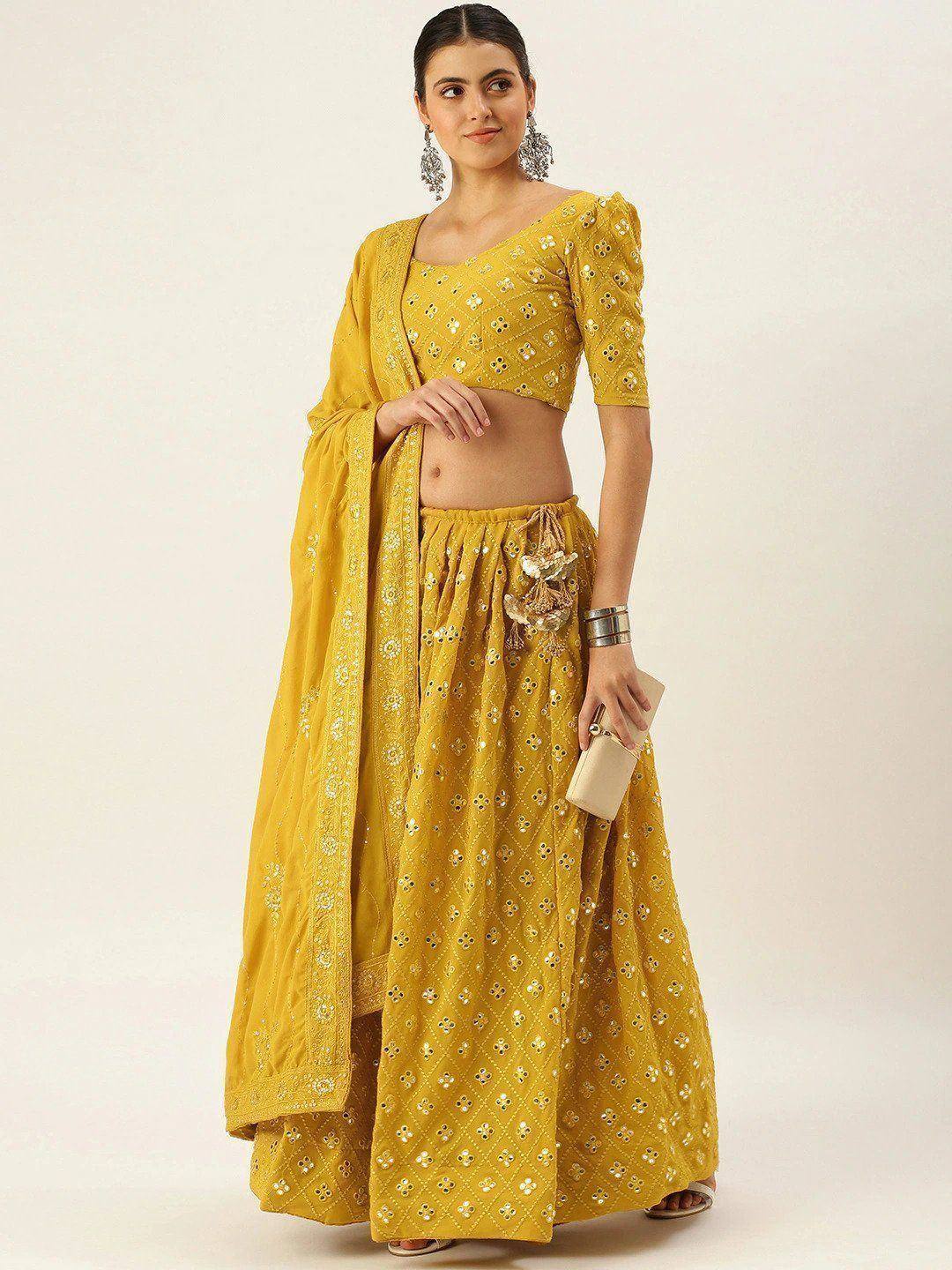 Yellow embroidered lehenga choli with mirror work, perfect for Indian ethnic wear occasions