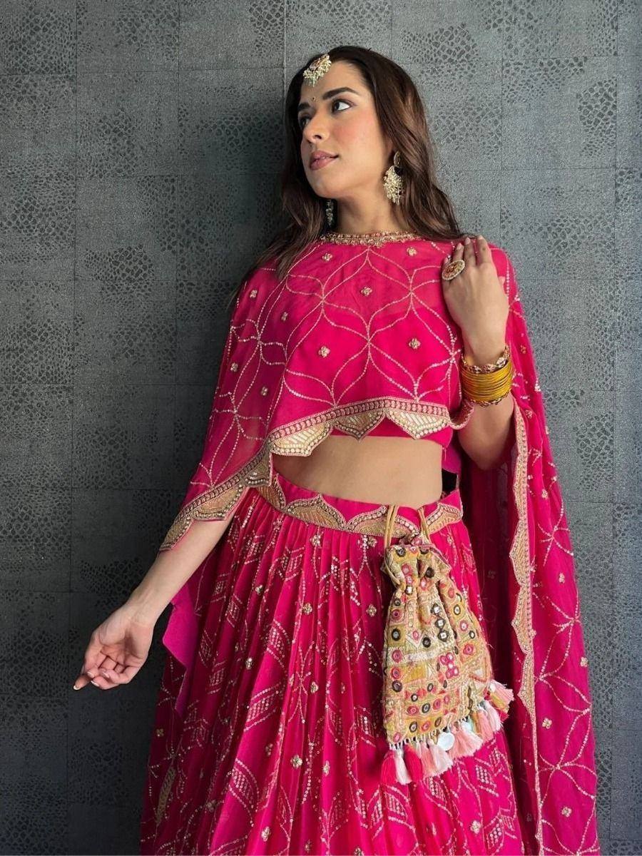 Pink embroidered lehenga choli with gold detailing, perfect for Indian ethnic wear and festive occasions