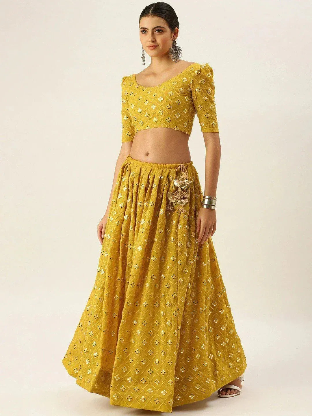 Yellow embroidered lehenga choli with mirror work, perfect for Indian ethnic occasions