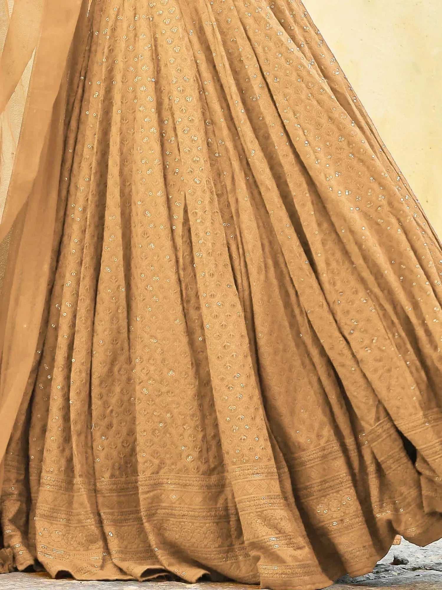 Golden beige lehenga with intricate embroidery and sequin detailing, perfect for Indian ethnic wear