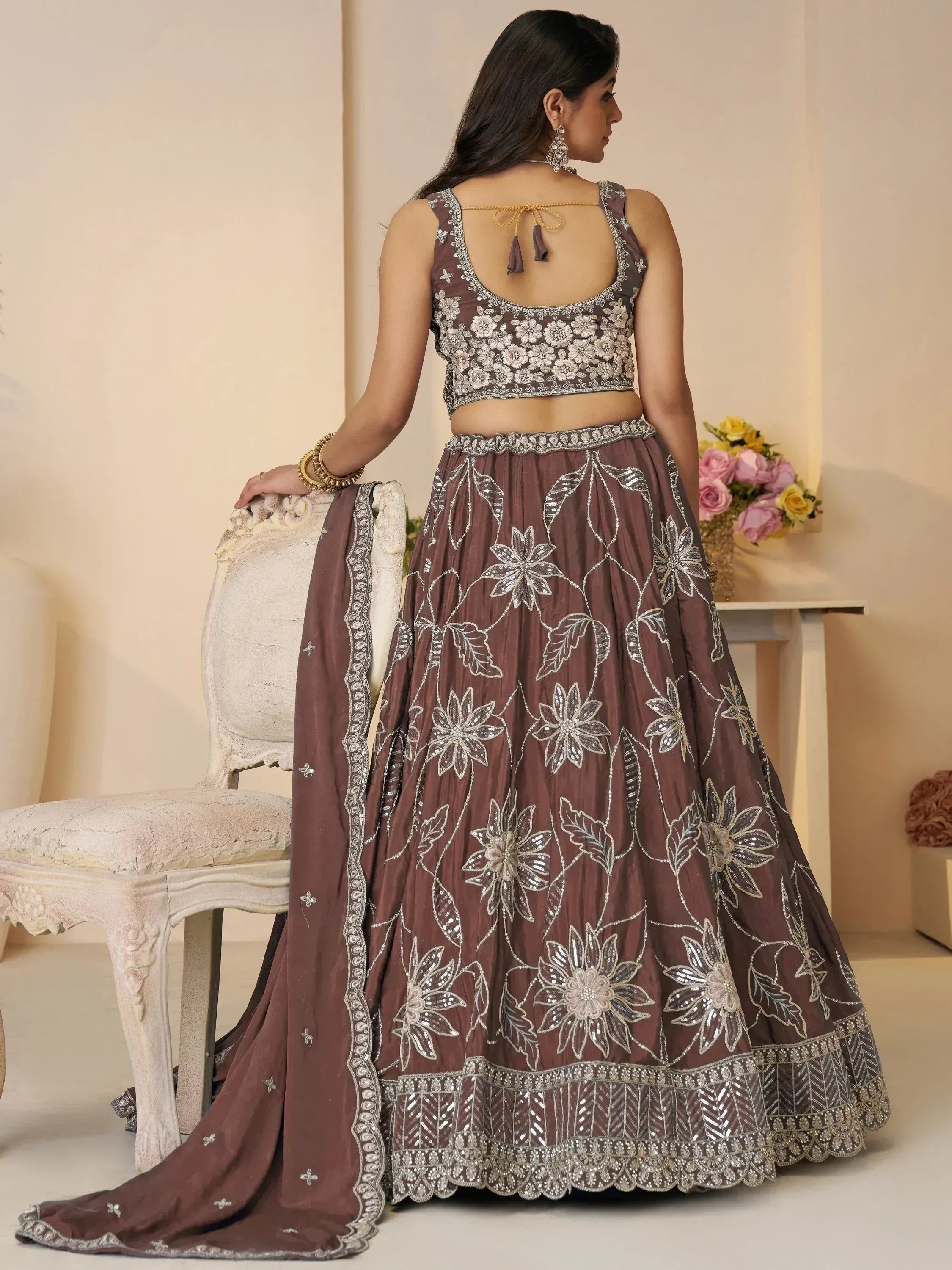 Brown floral embroidered lehenga choli with back tie blouse, perfect for Indian ethnic wear occasions.